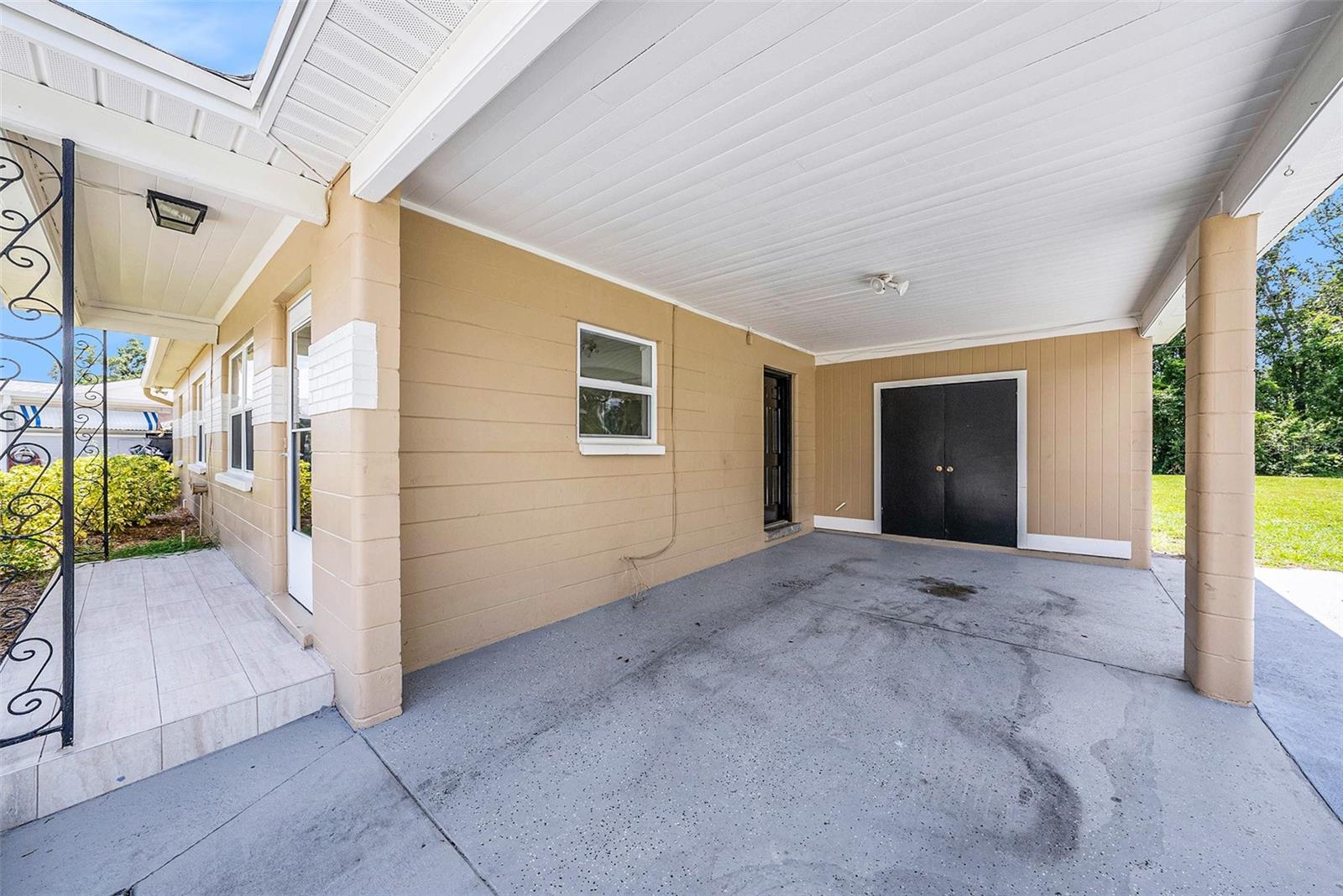 Carport (double doors lead to utility closet)