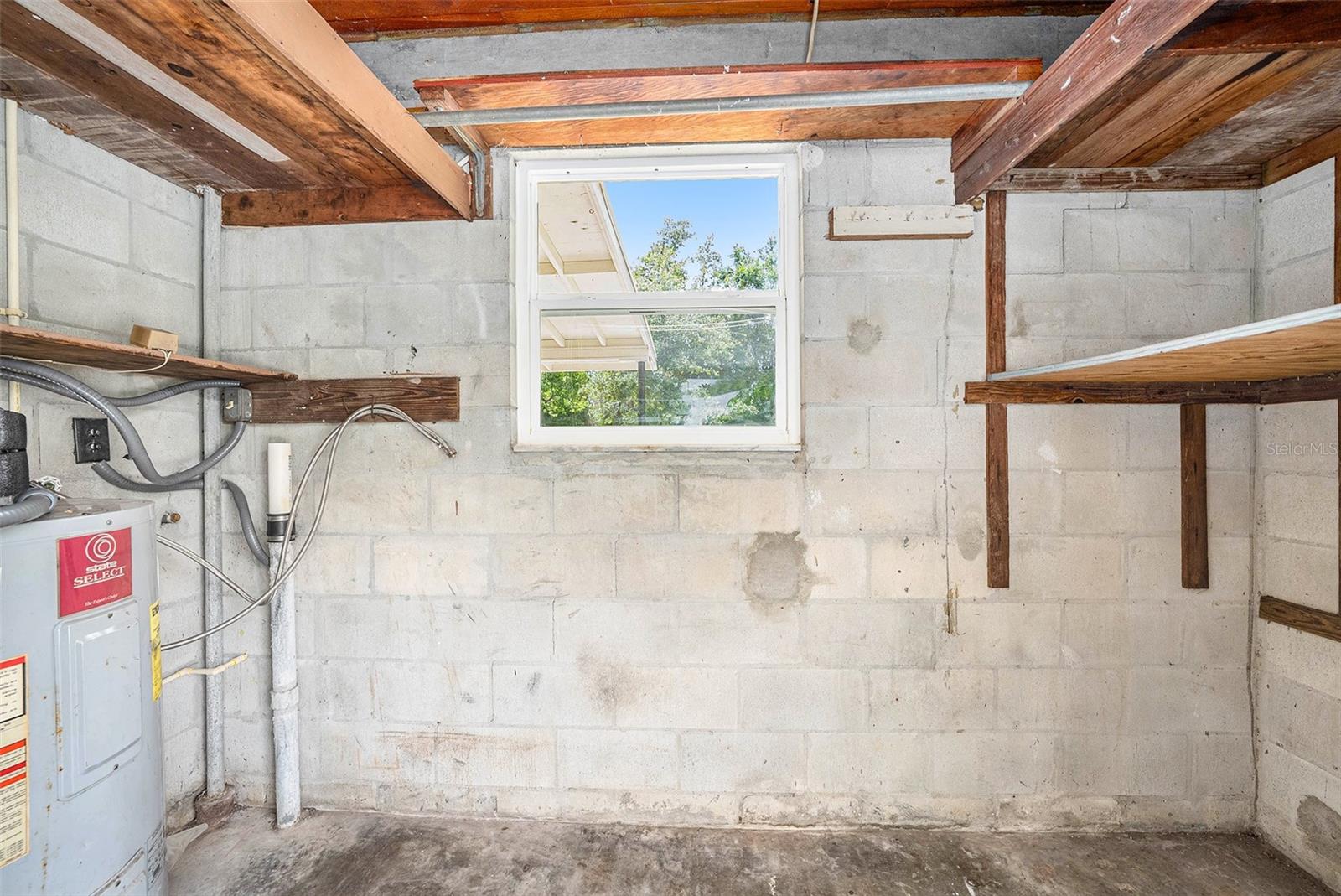 Utility closet for washer and dryer (off carport)