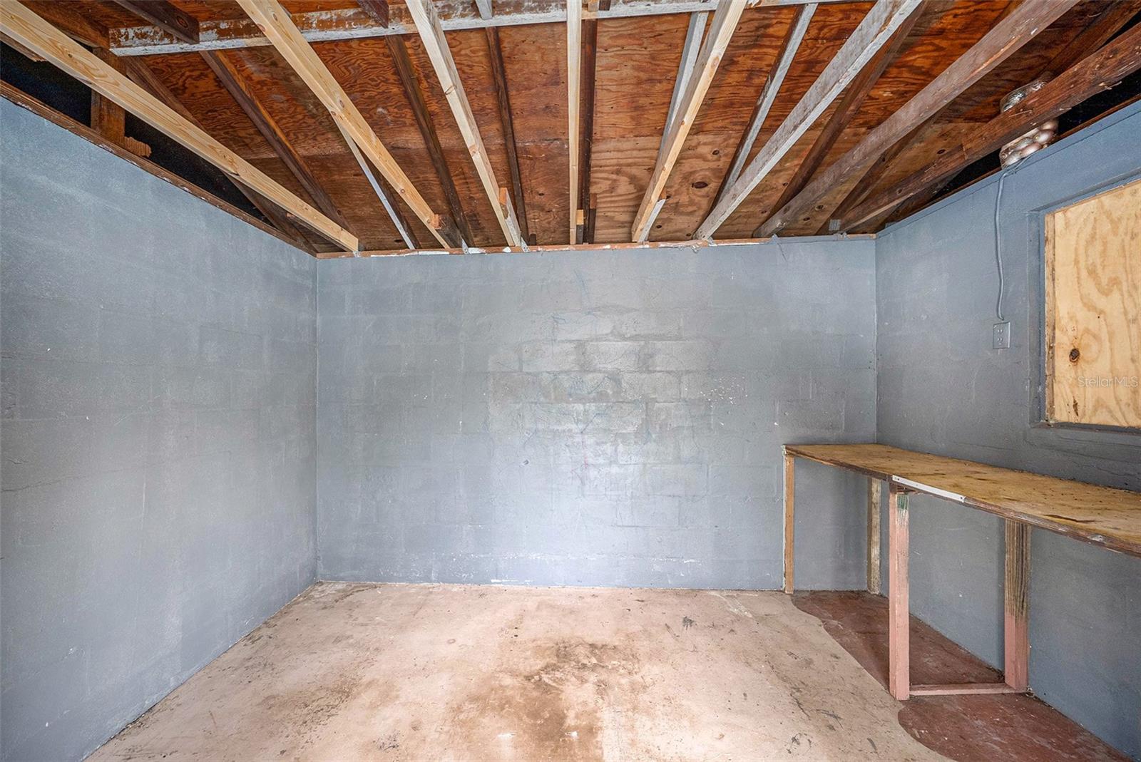 Interior of freestanding backyard utility shed.