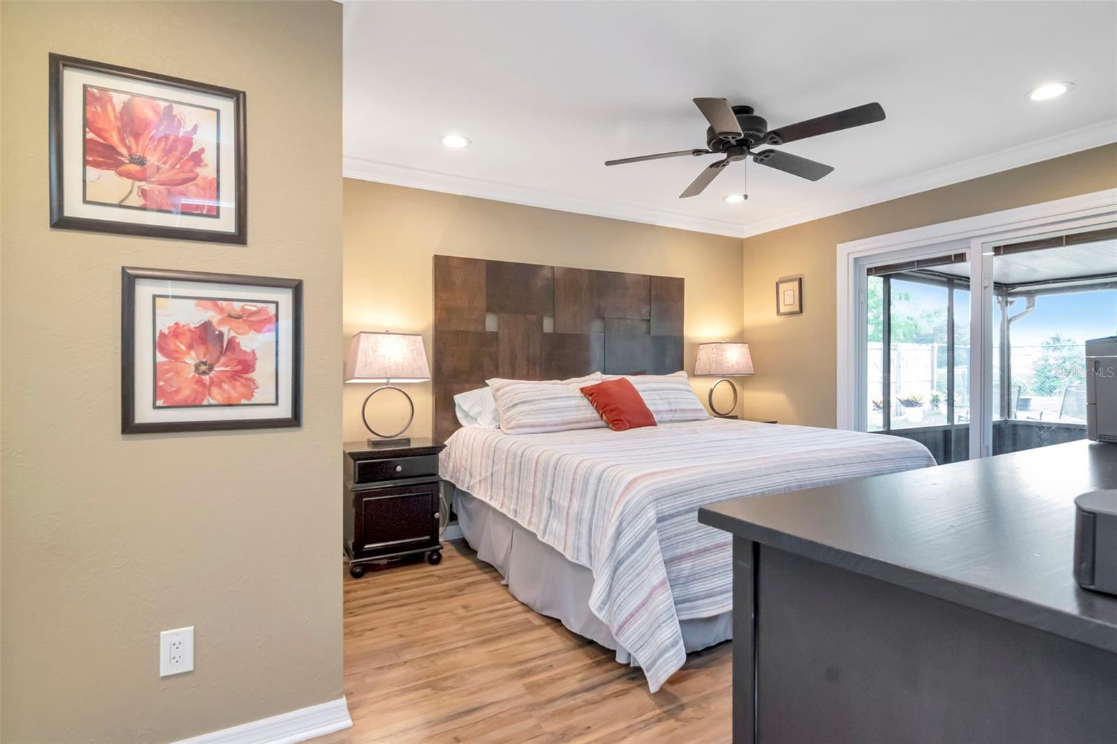 Main Bedroom with sliding glass doors to screened patio