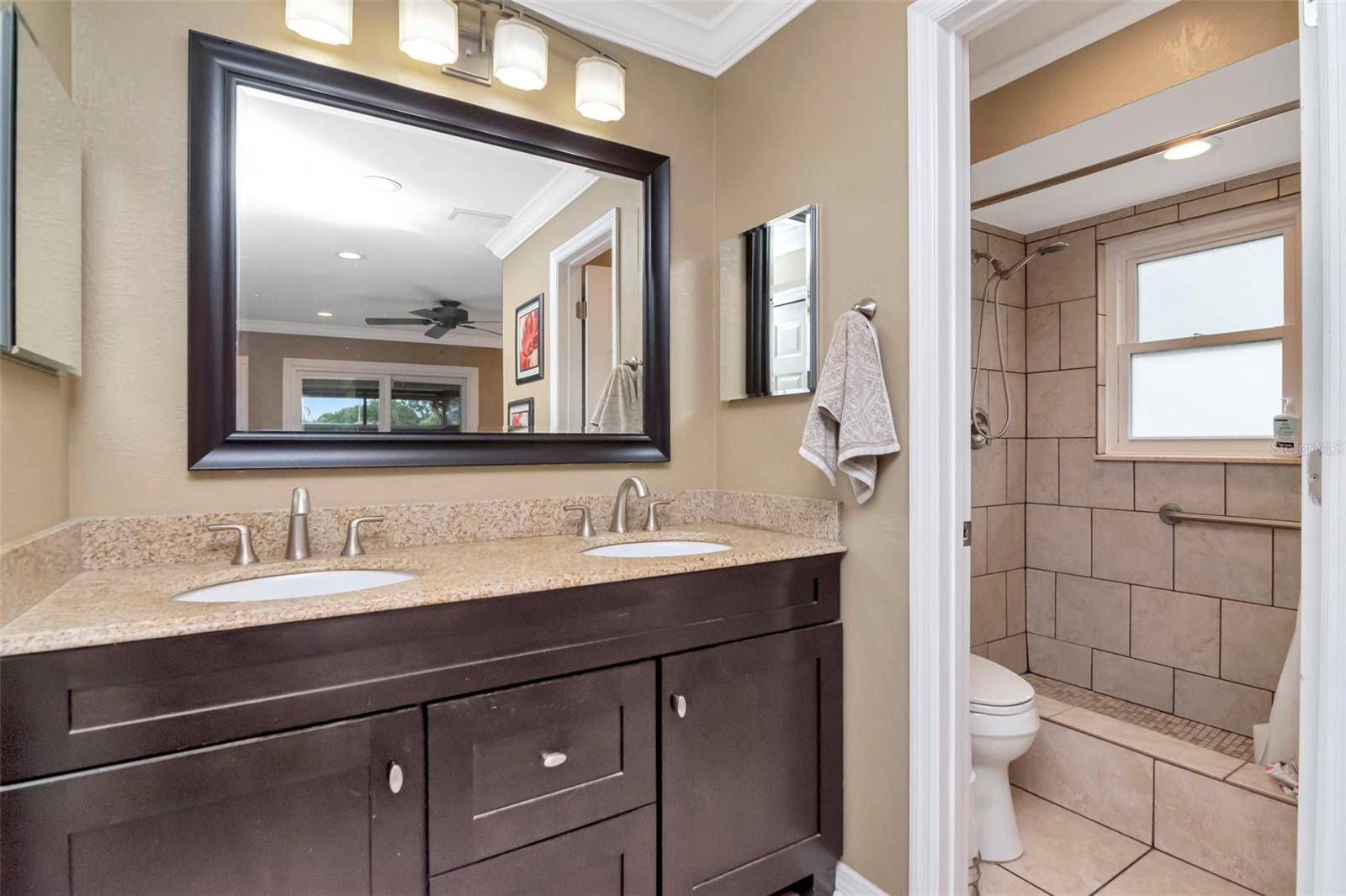 Main bath with double vanity and walk-in shower