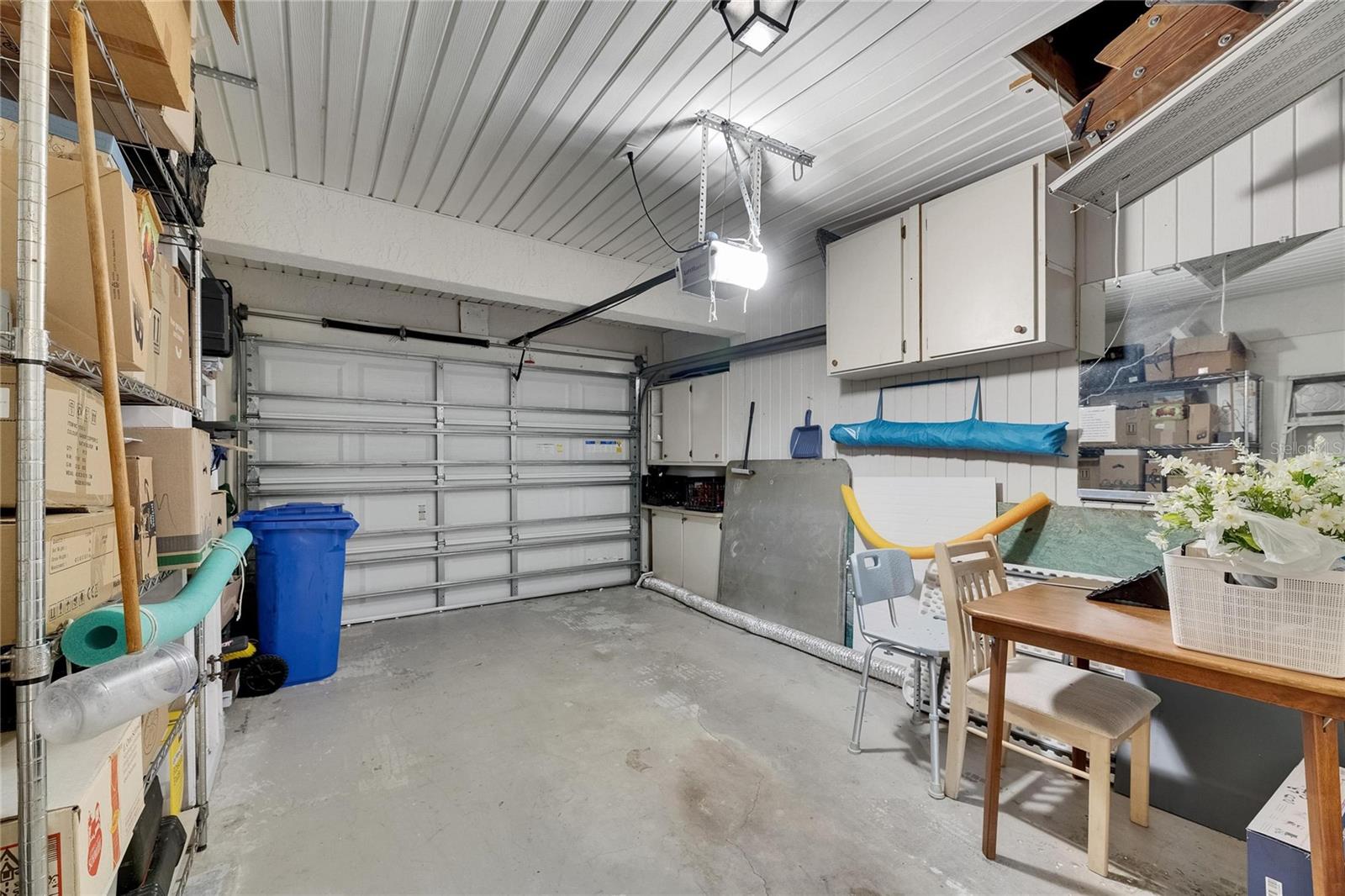 Garage has hurricane rated door with electric opener