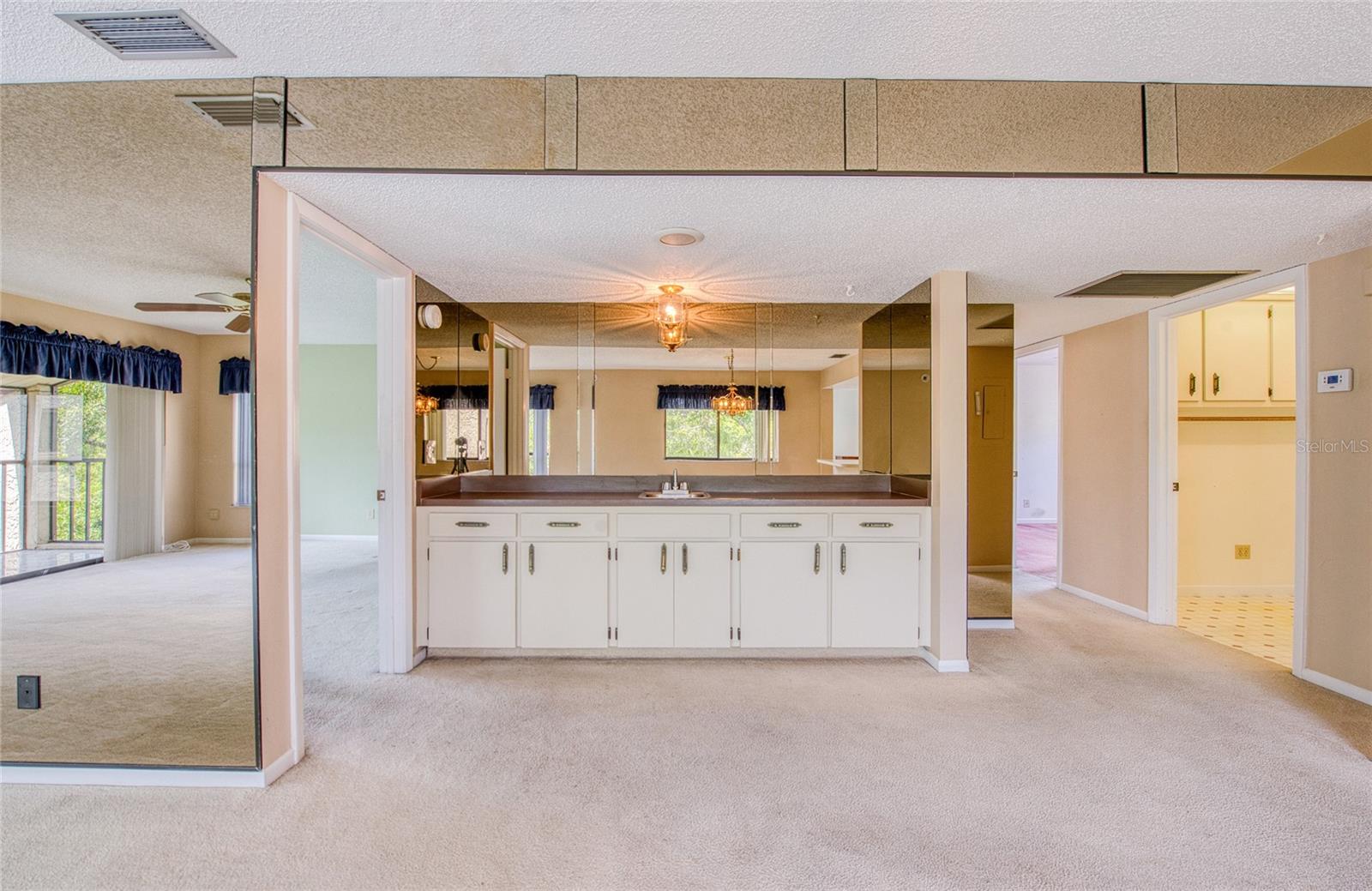 DINING AREA WITH BAR FOR SEATING AT THE KITCHEN