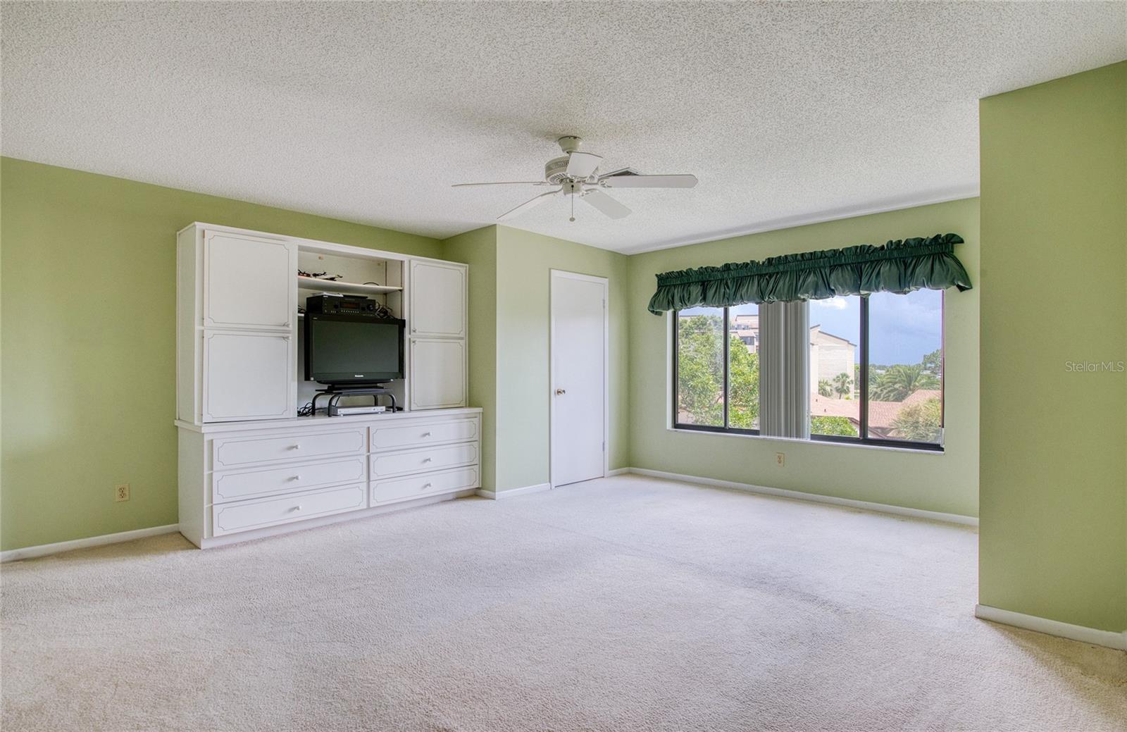 PRIMARY BEDROOM HAS TWO LARGE WALKIN CLOSETS AND A BUILT IN CABINET