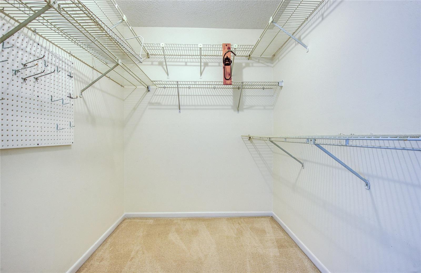 LARGE WALKIN CLOSET WITH ATTIC ACCESS.