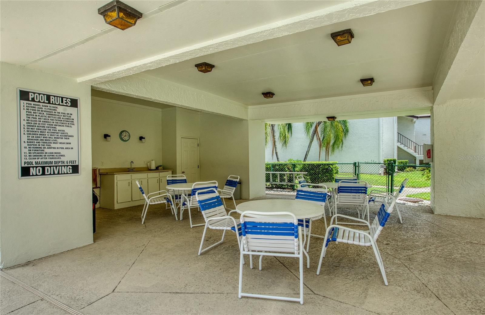 POOL CLUB AREA-GREAT FOR ENTERTAINING FAMILY AND FRIENDS. WITH RESTROOMS AND KITCHEN COUNTER WITH SINK