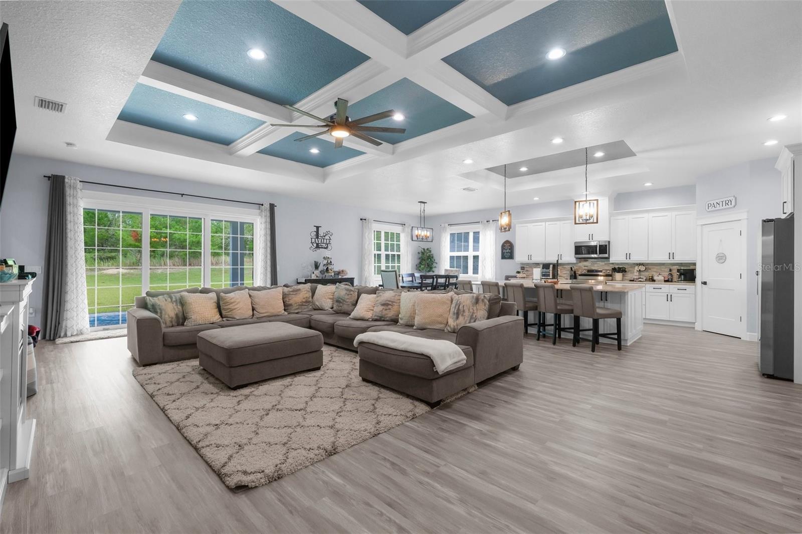 Stunning open floor plan with triple glass sliders to outdoor living space.