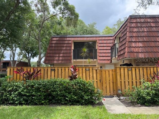 Fully fenced front yard with beautiful landscaping