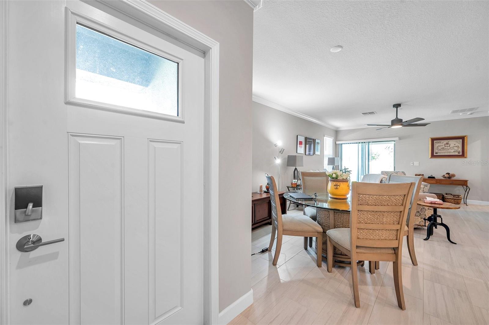 Front door, dining room and living room