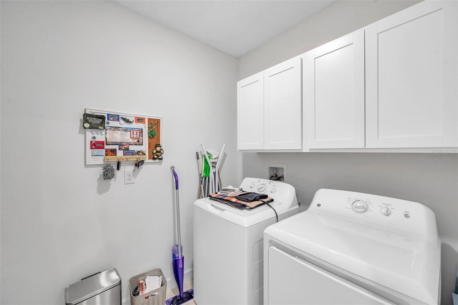 Laundry room with storage cabinets