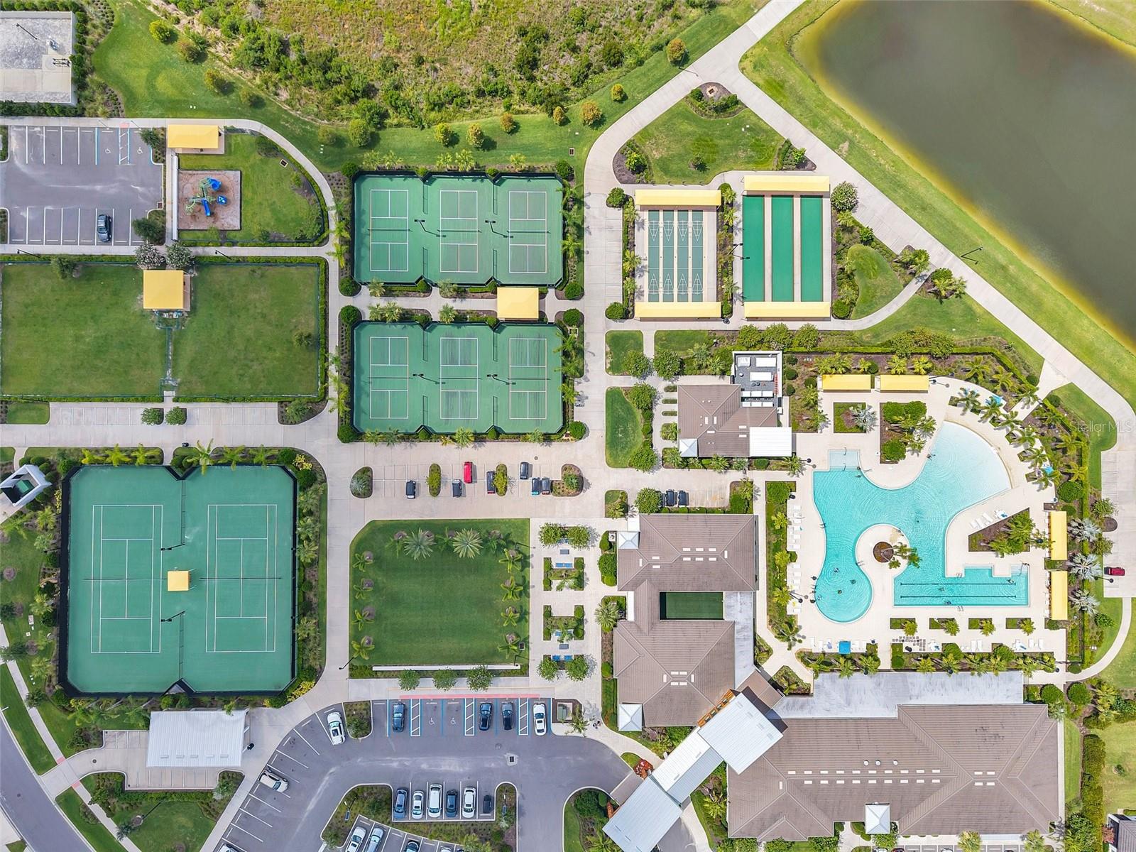 Overhead shot of most of the amenities at the Medley at Mirada - tennis courts, pickleball courts, bocce ball, shuffleboard, community pool, dog park, etc.