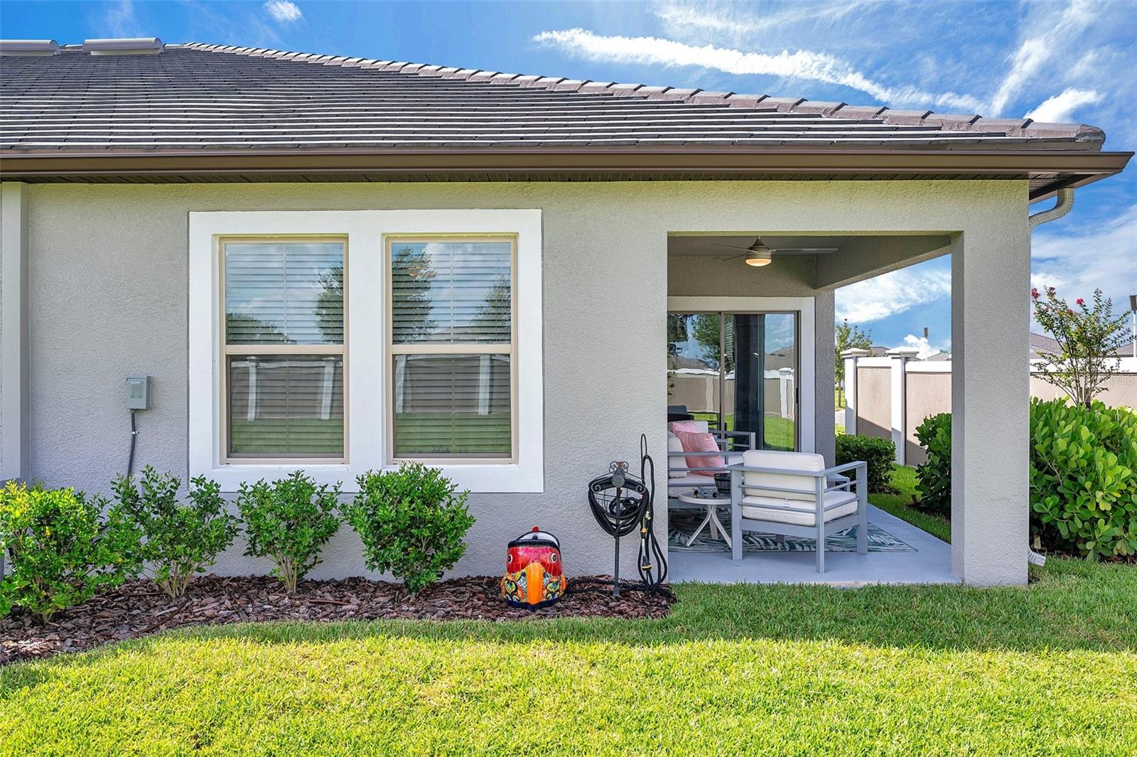 View of covered patio from backyard