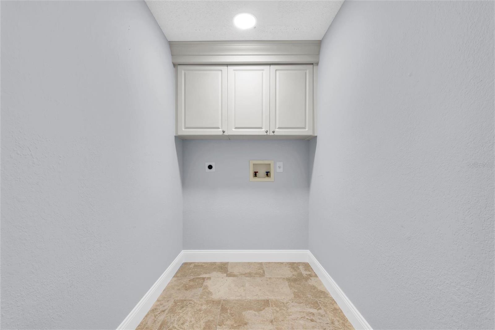 Laundry Room Off Two Car Garage.