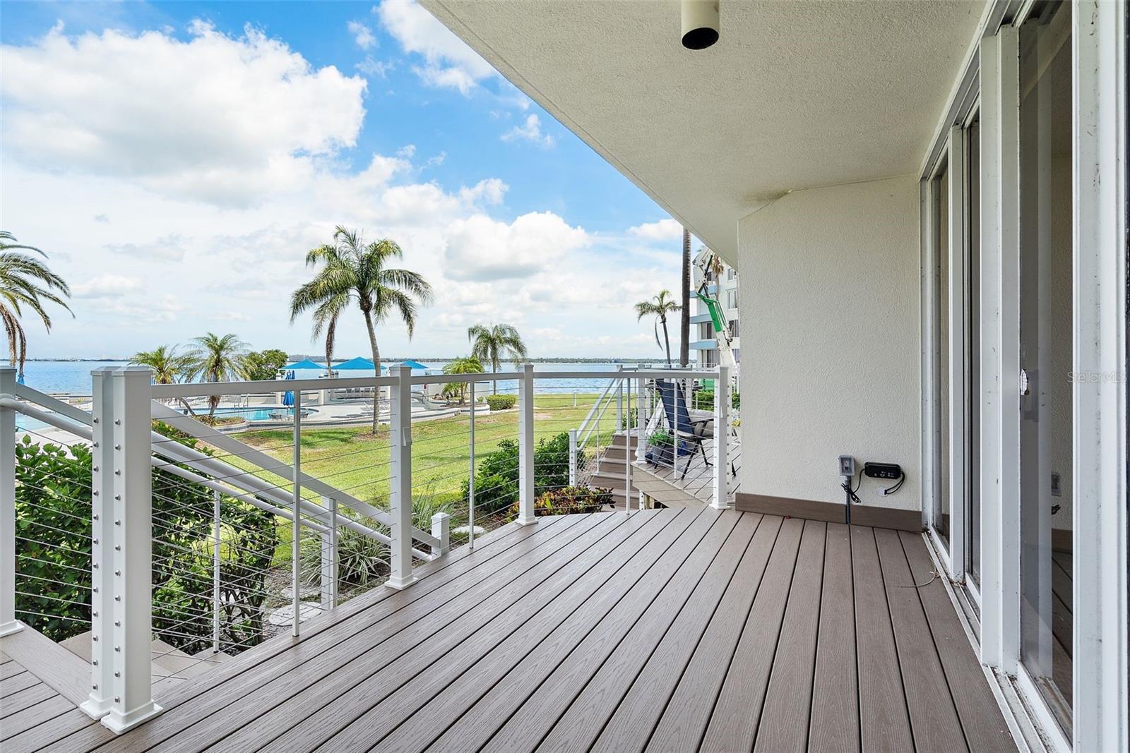New large private outdoor deck allows you endless days of sitting, grilling and soaking up the sun while taking in the breathtaking views of Bocca Ciega Bay and sunsets.