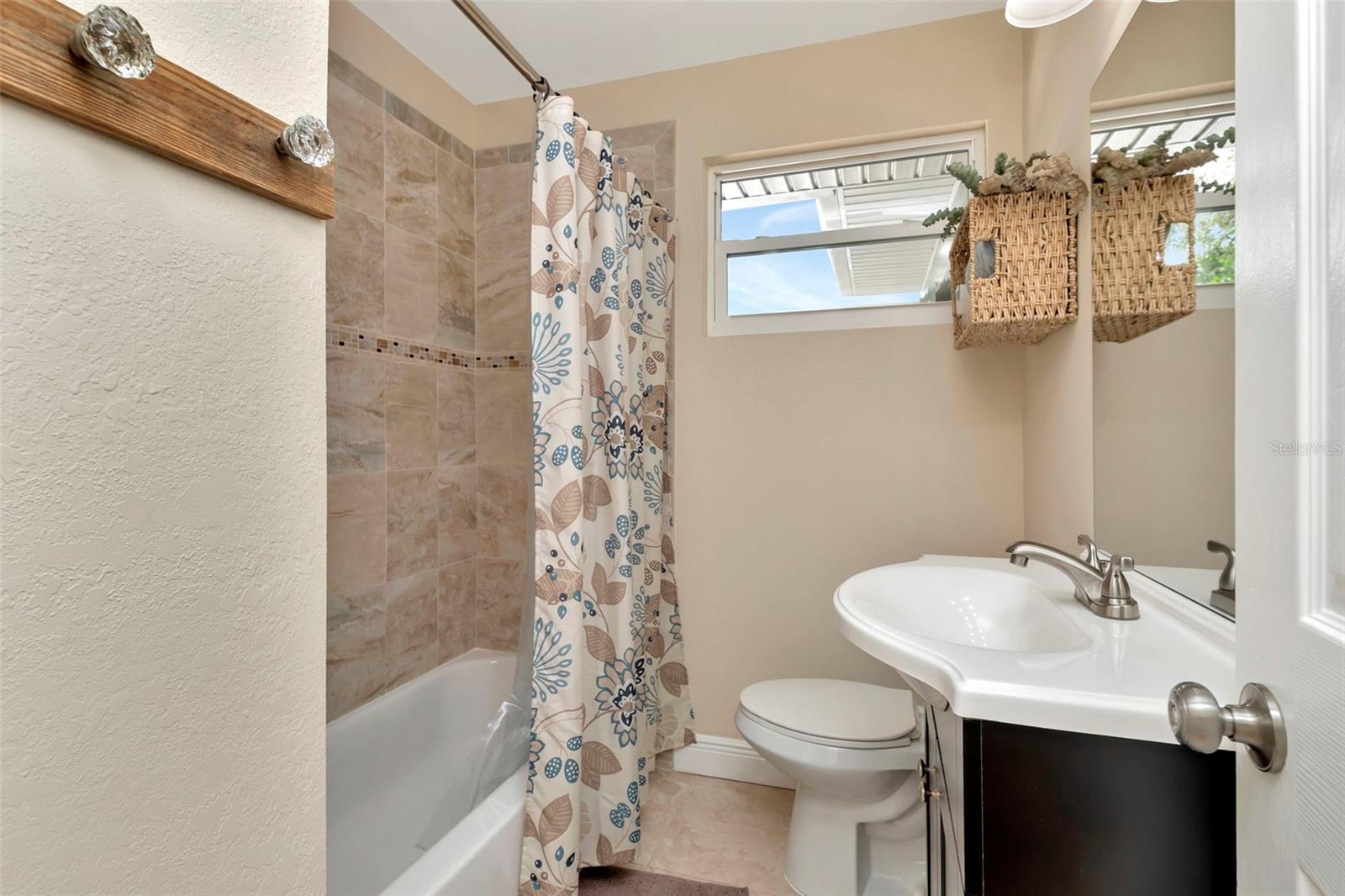 Guest bathroom with shower and tub