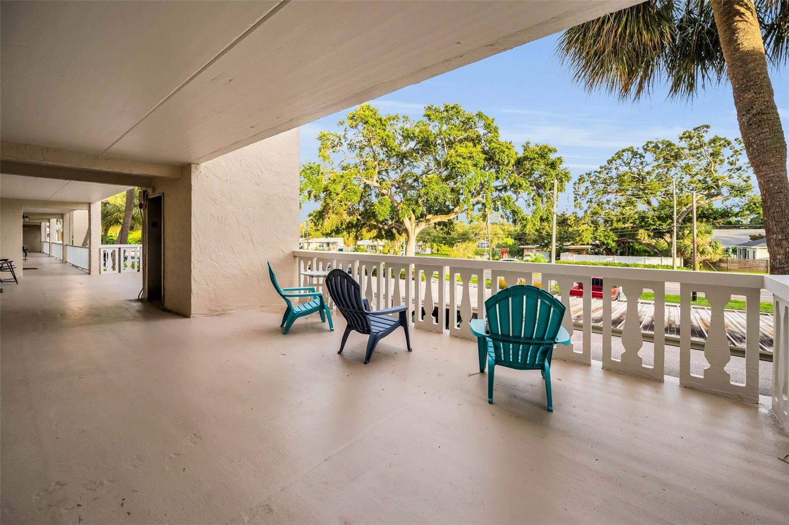 Enjoy covered seating and uncovered seating on the open veranda right in front of your door.  The elevator is just to the left of the door.