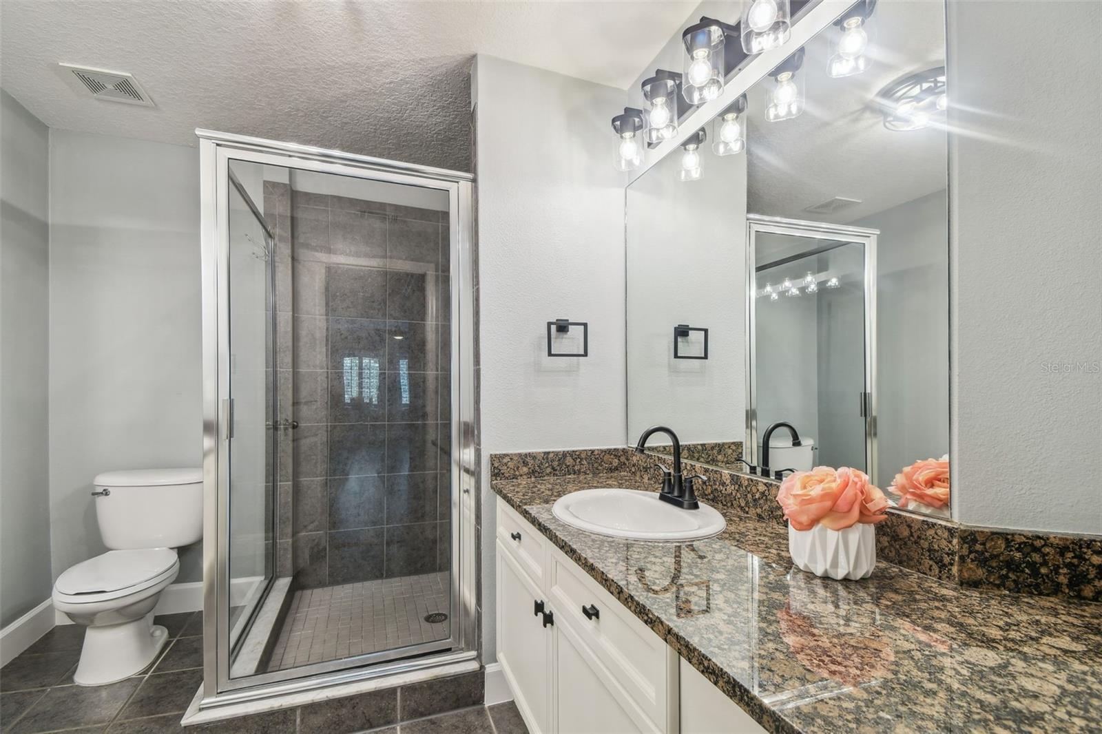 Primary bathroom with double sink vanities.
