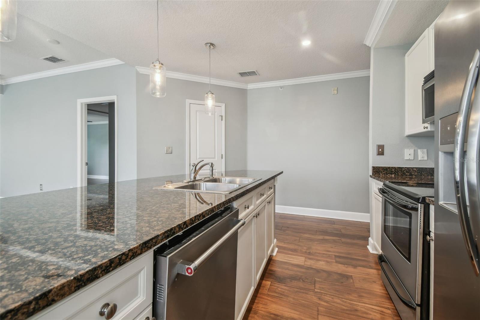 Breakfast bar and double stainless-steel sinks.