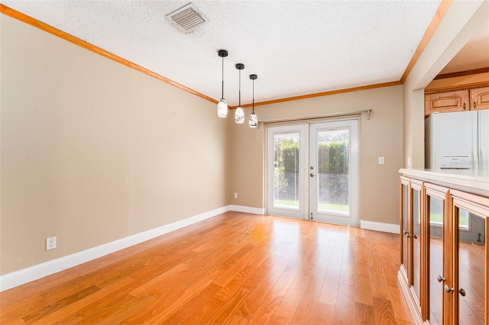 Dining Area with French Doors to Back Deck