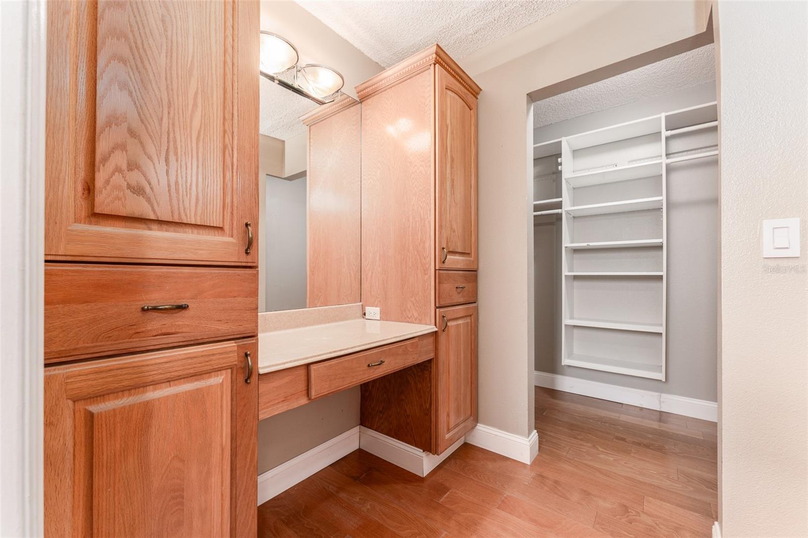 Primary EnSuite Dressing Area with Storage & Walk in Closet with Shelving