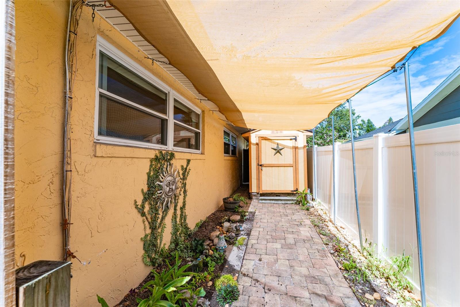 Covered Garden Area in Sideyard leading to Storage Shed