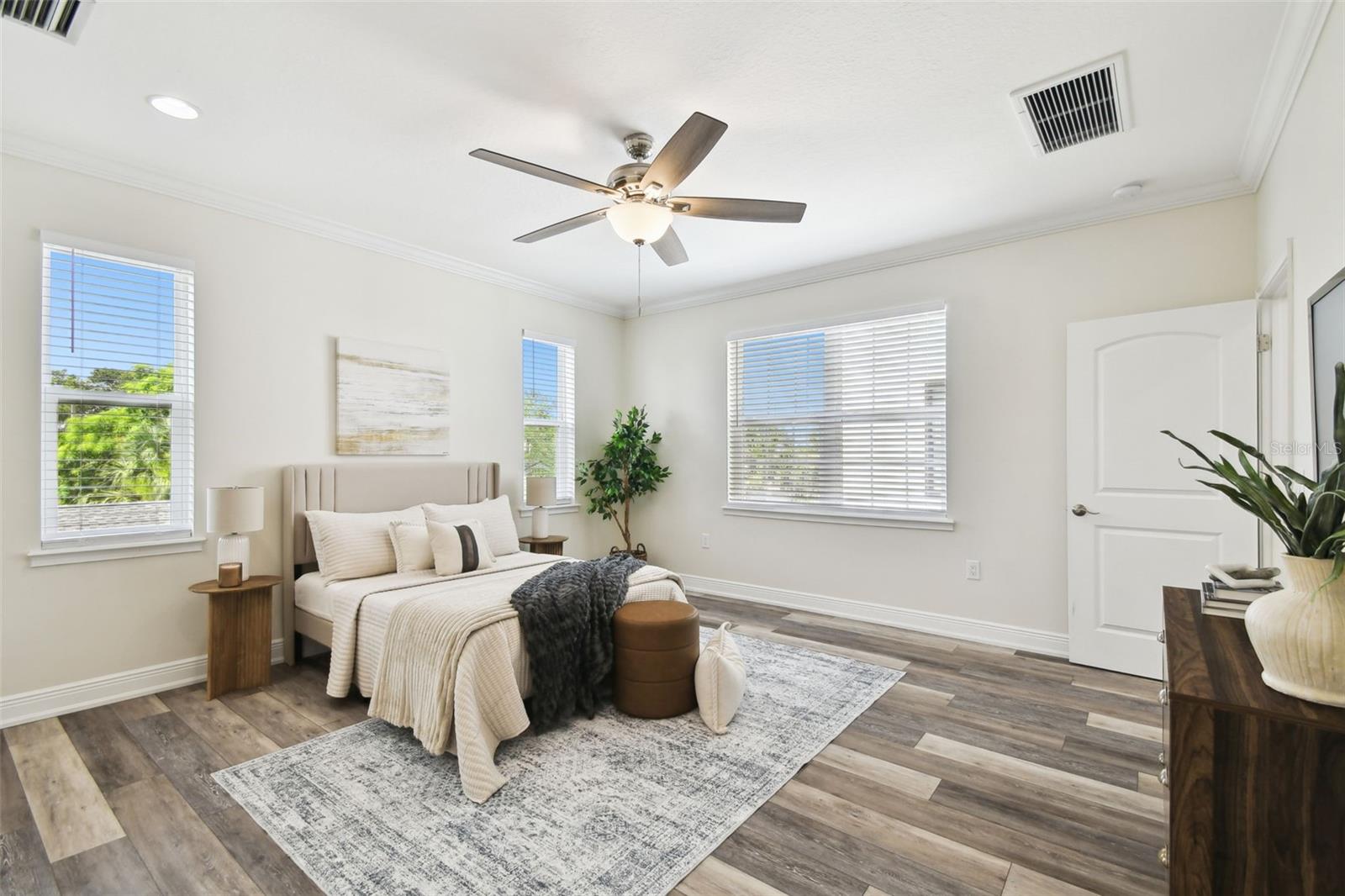 Primary Suite - generous in size with lots of windows and natural light