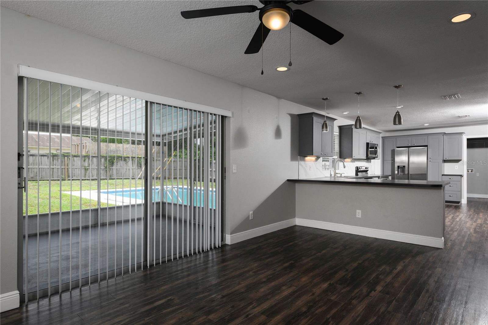 Dining Room with View of Porch and Pool