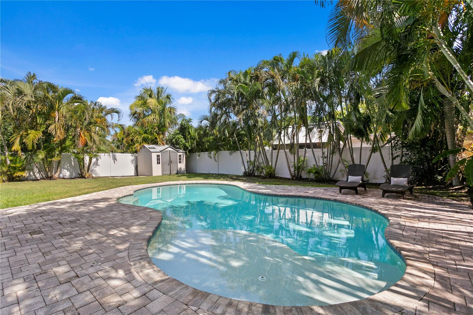 Pretty Saltwater Pool with Expansive Pavers