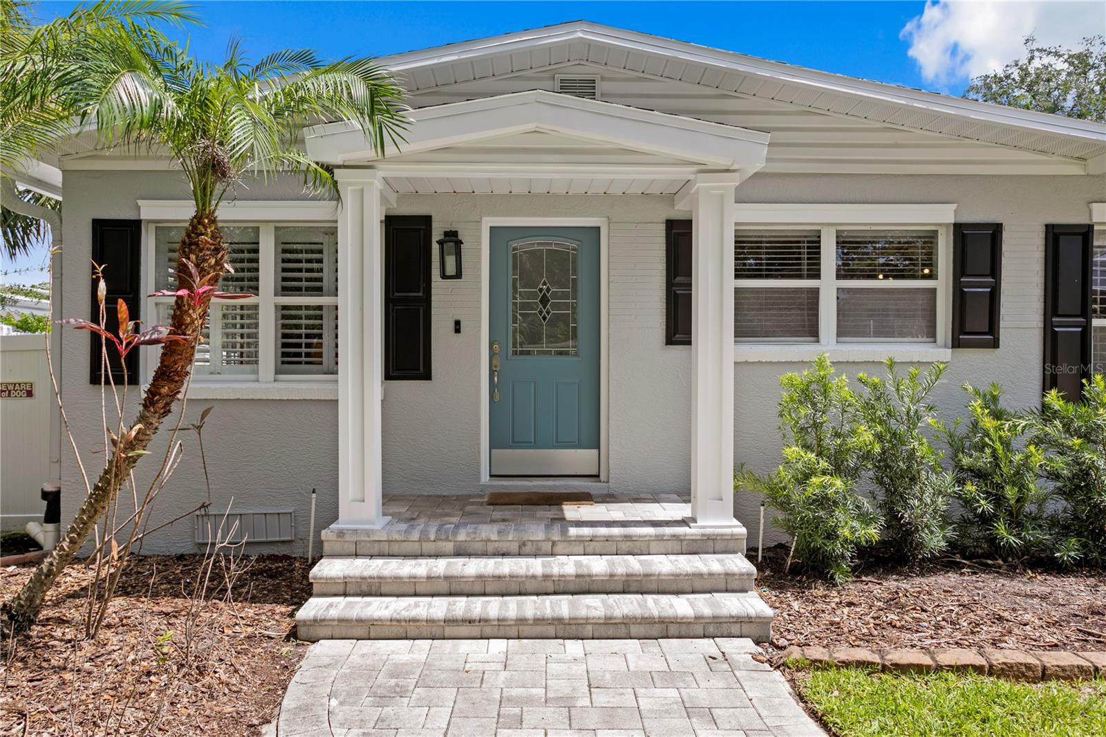 Covered front porch with custom pavers