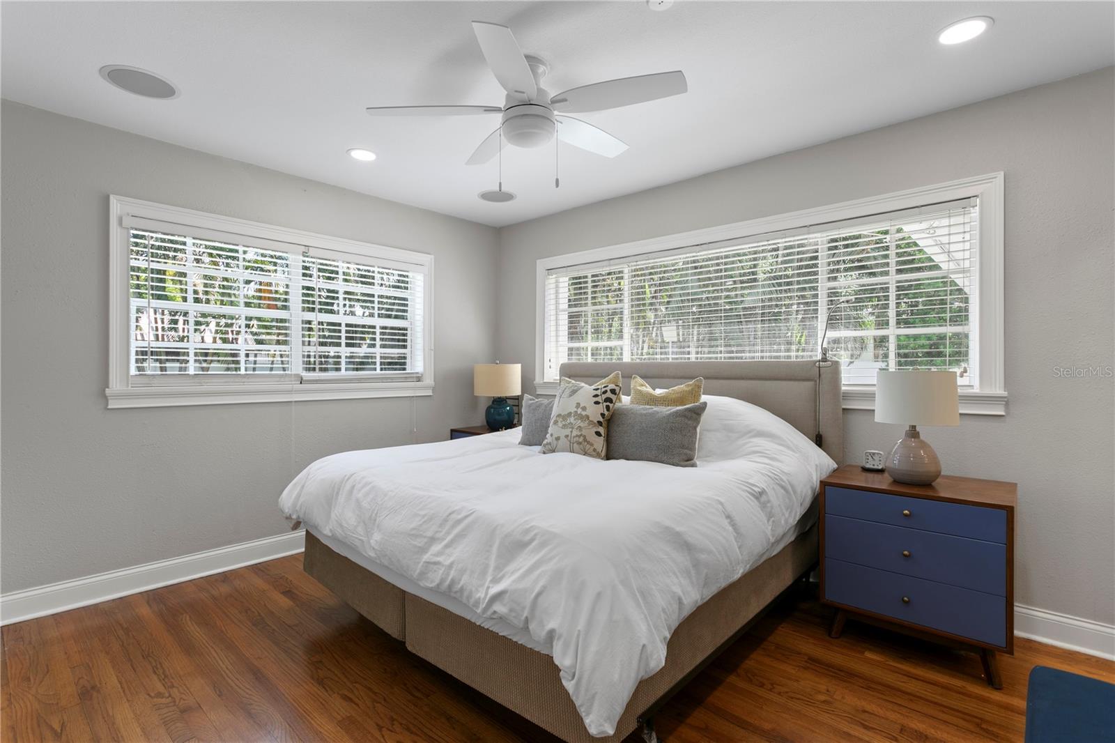 Primary bedroom with views of the lush backyard