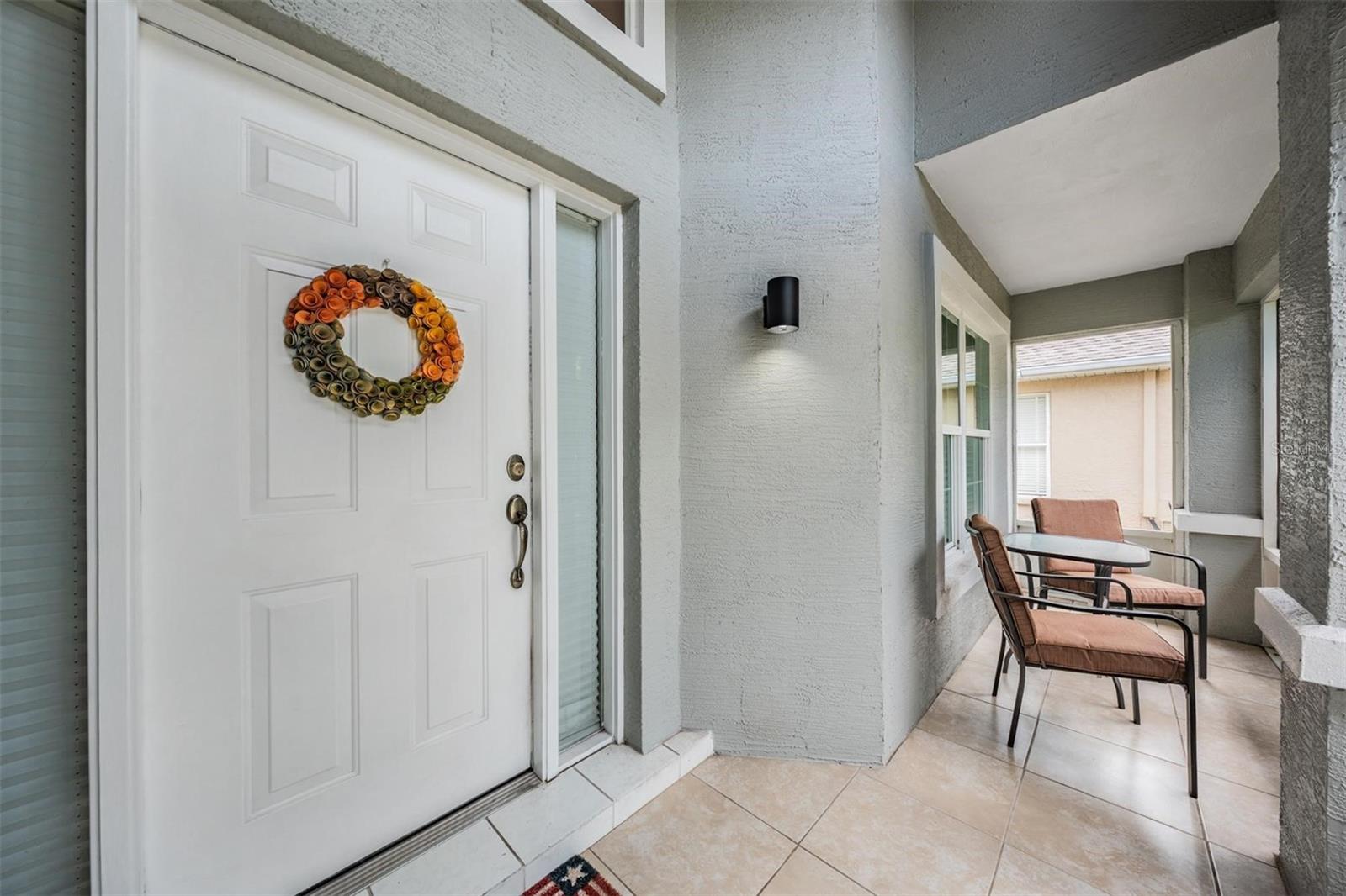 Tiled and screened front porch