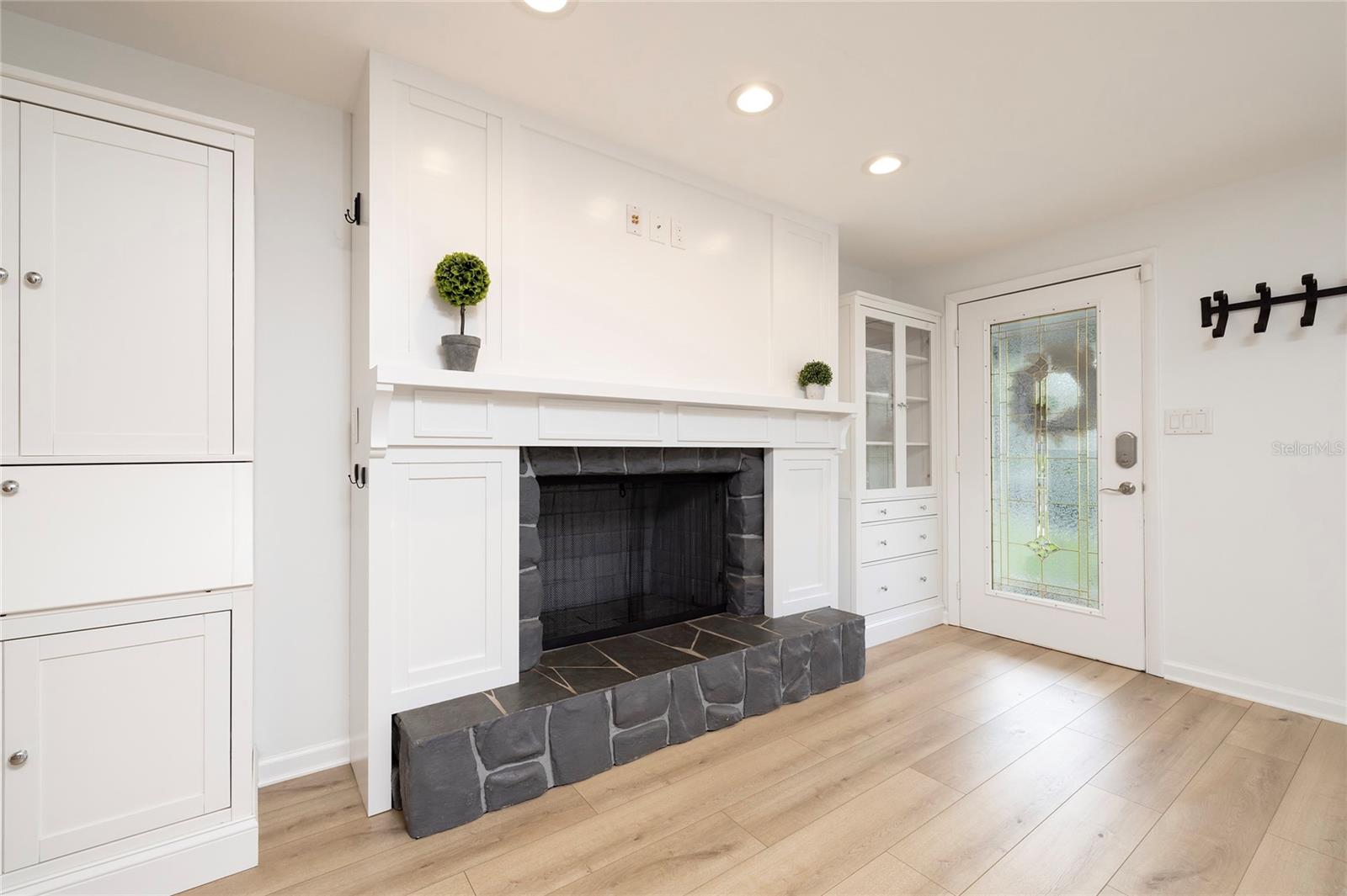 Fireplace with TV plug ins and cabinetry