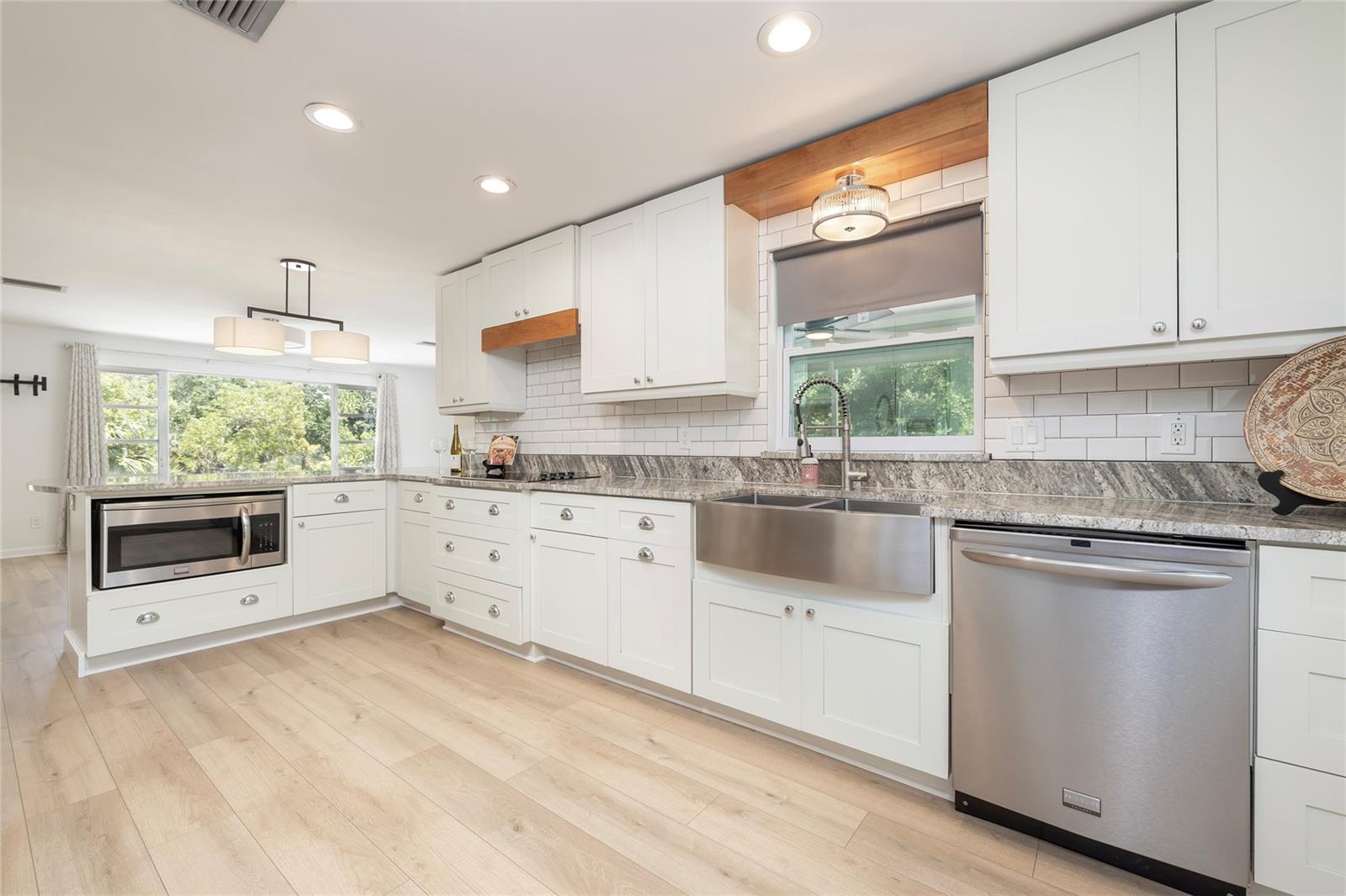 Remodeled kitchen with granite counter and stainless appliances