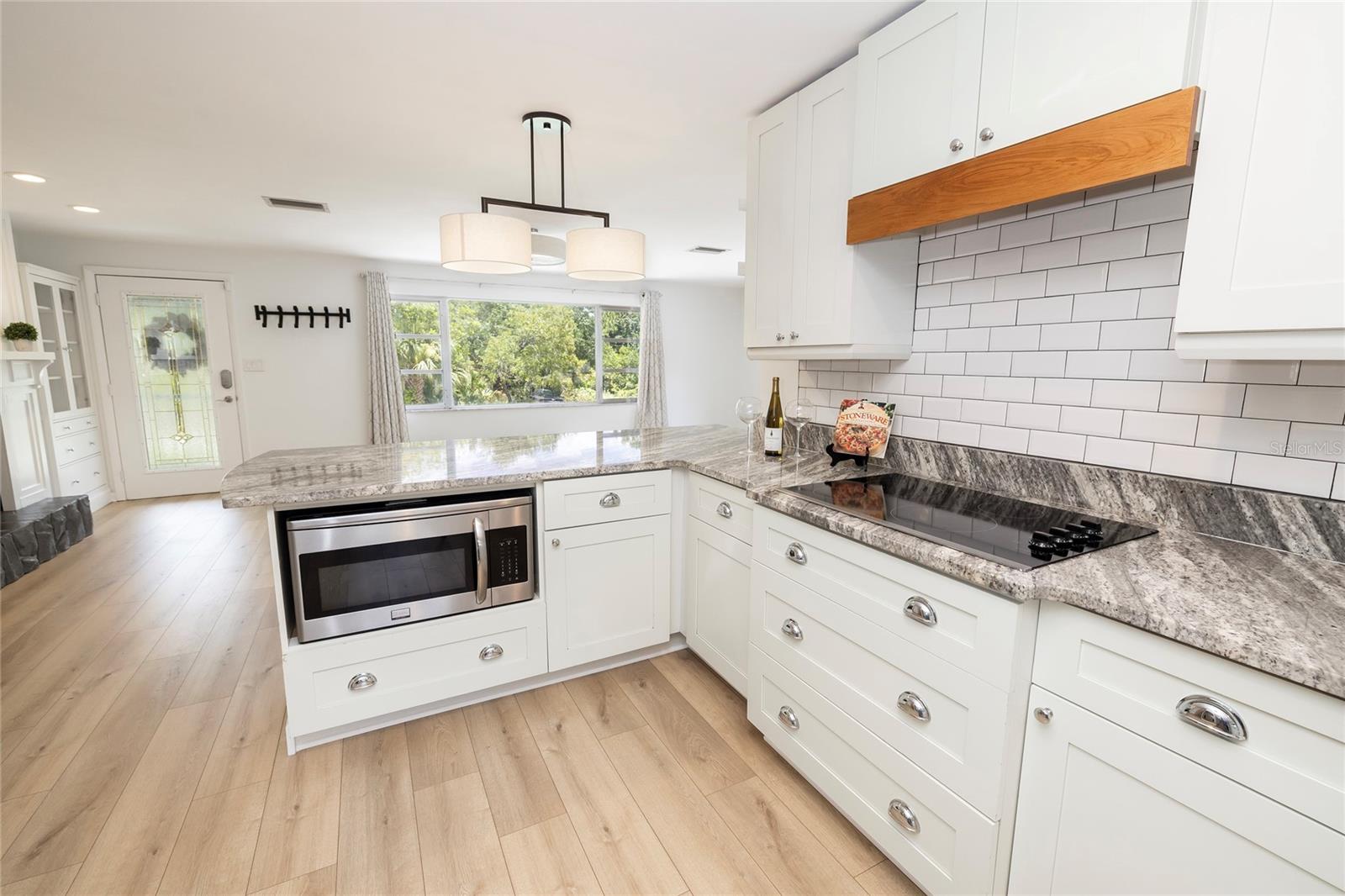 Open to the great room with upscale large counter