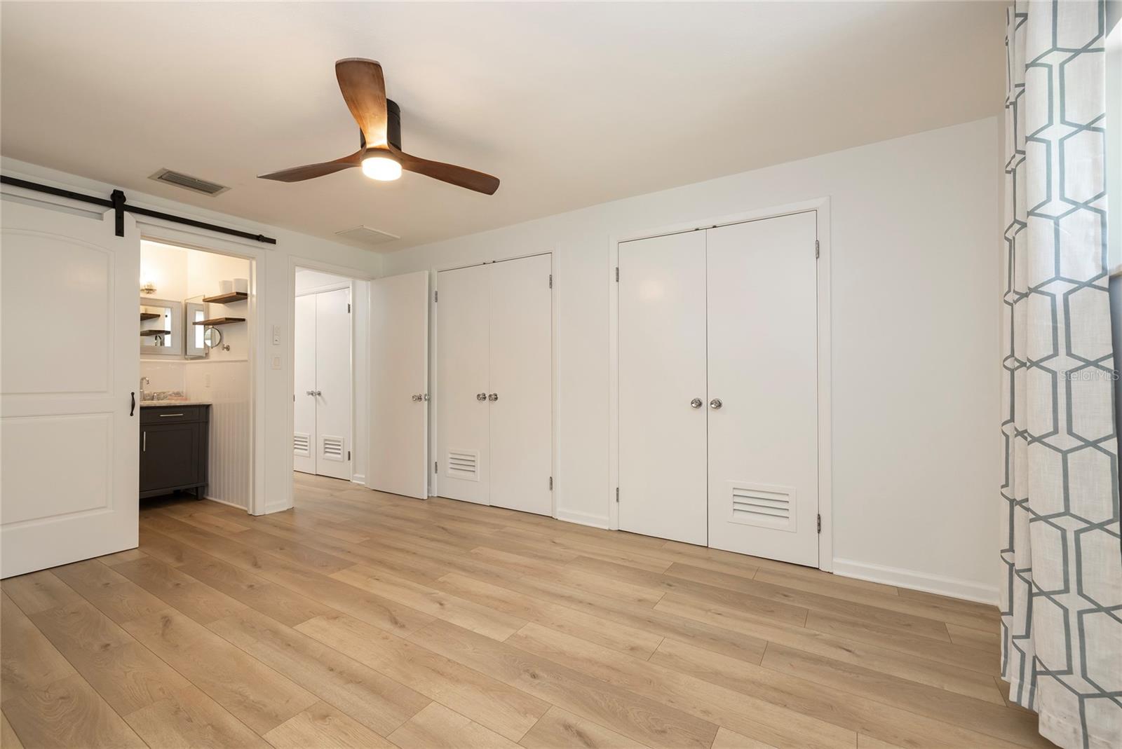 Love the door to the bathroom and double closets