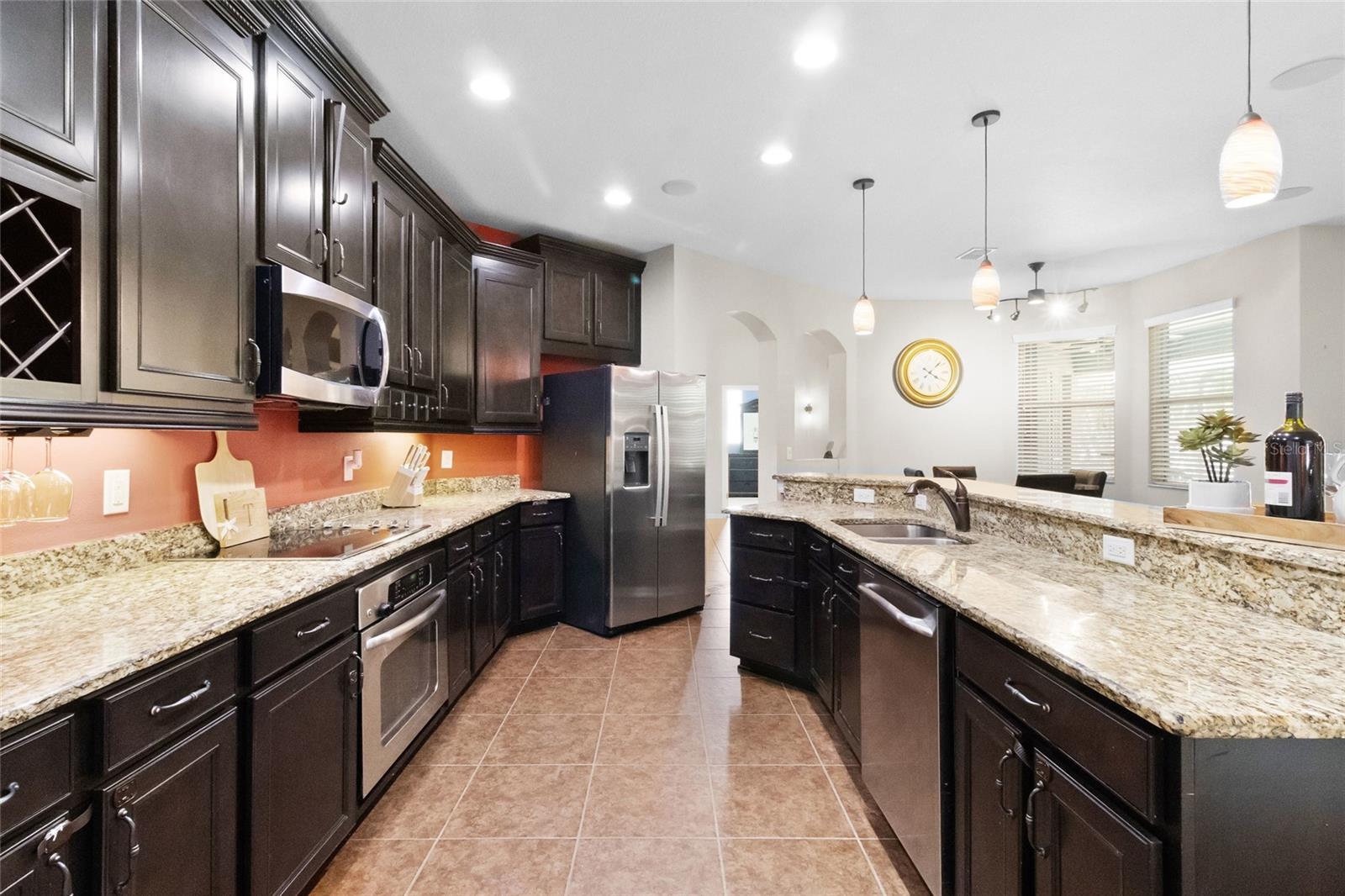 Ebony 42 inch cabinets and built in wine-rack. Stainless Steel Appliances transfer upon sale.