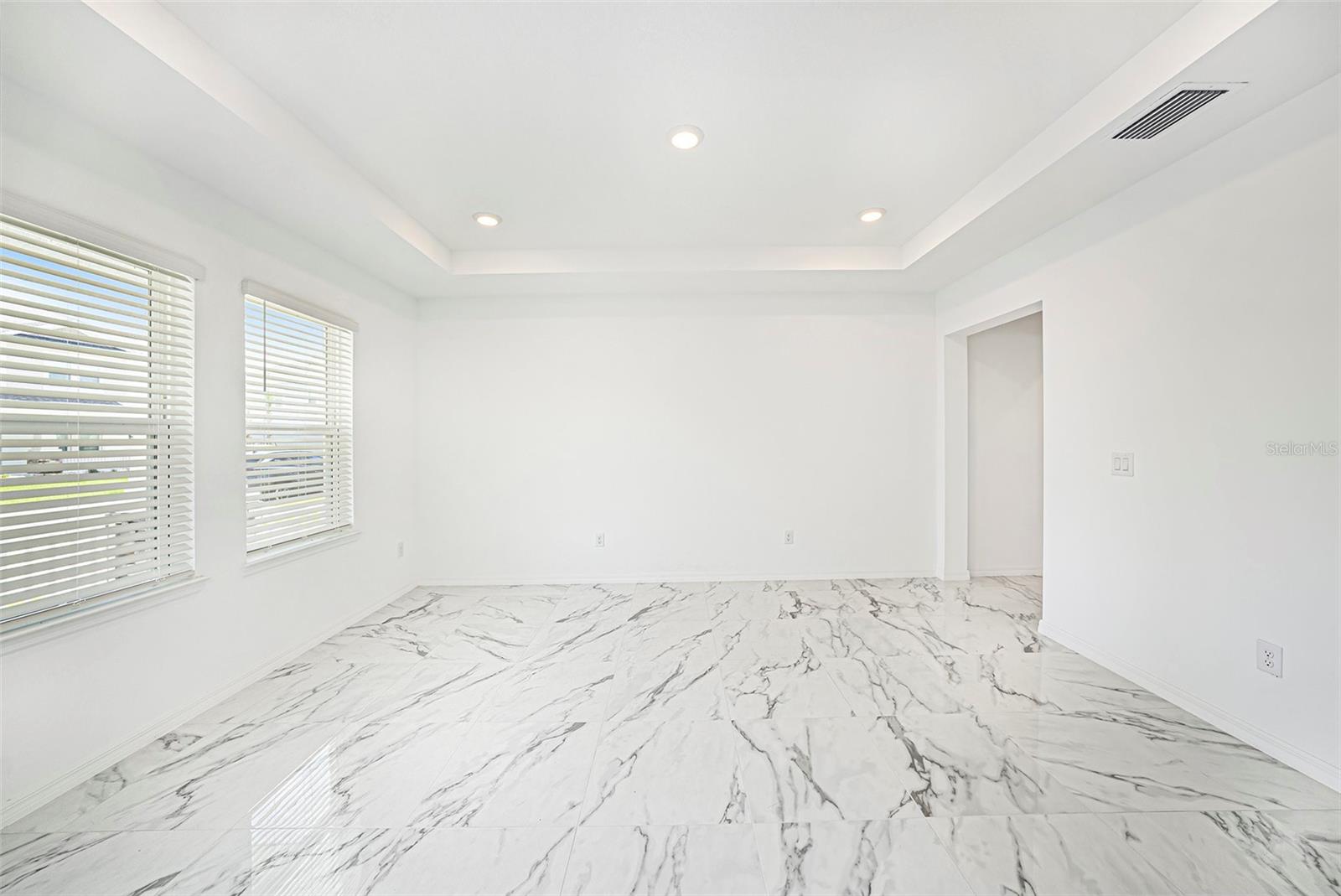 The formal family room leading into the Kitchen