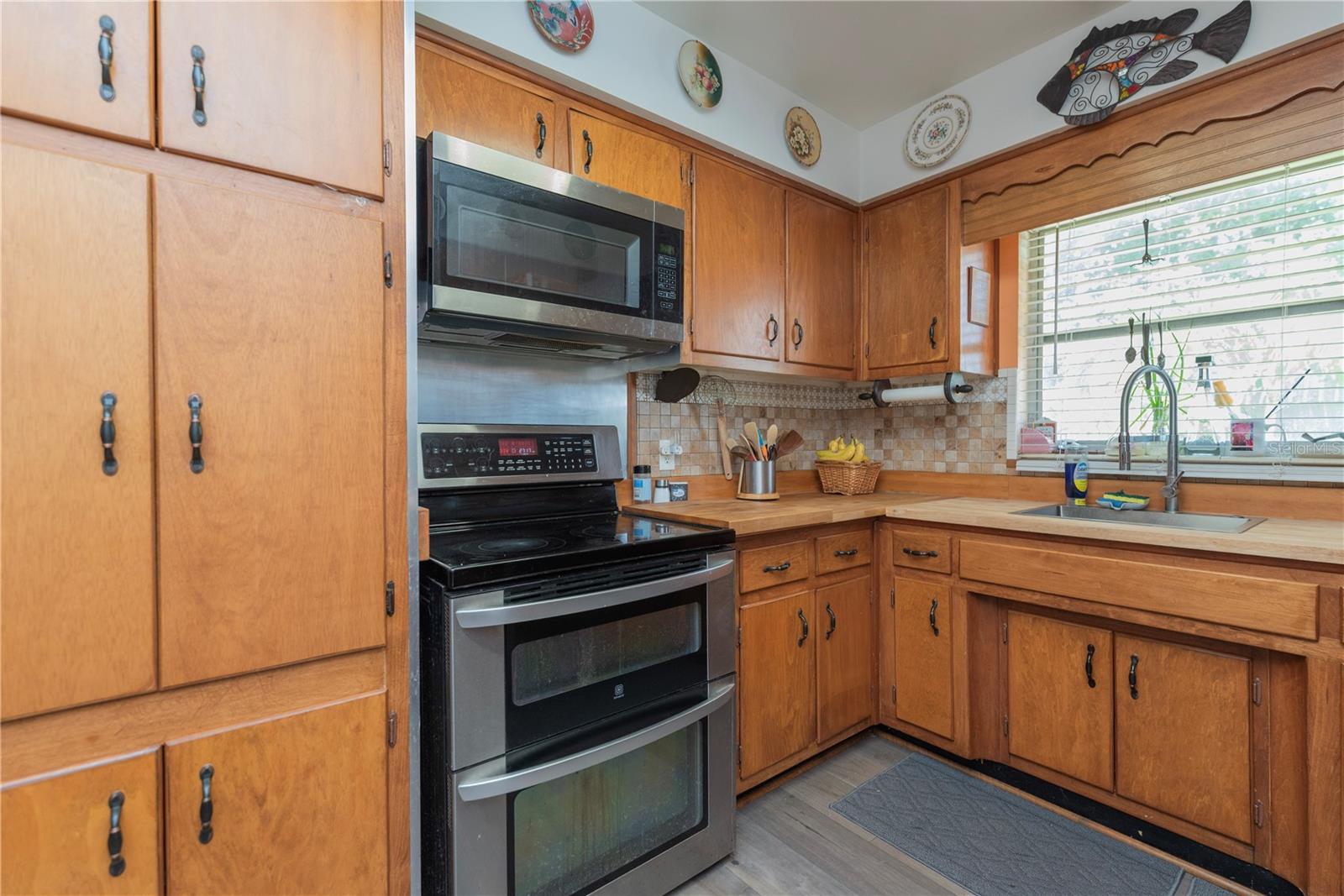 Kitchen with cabinet pantry.