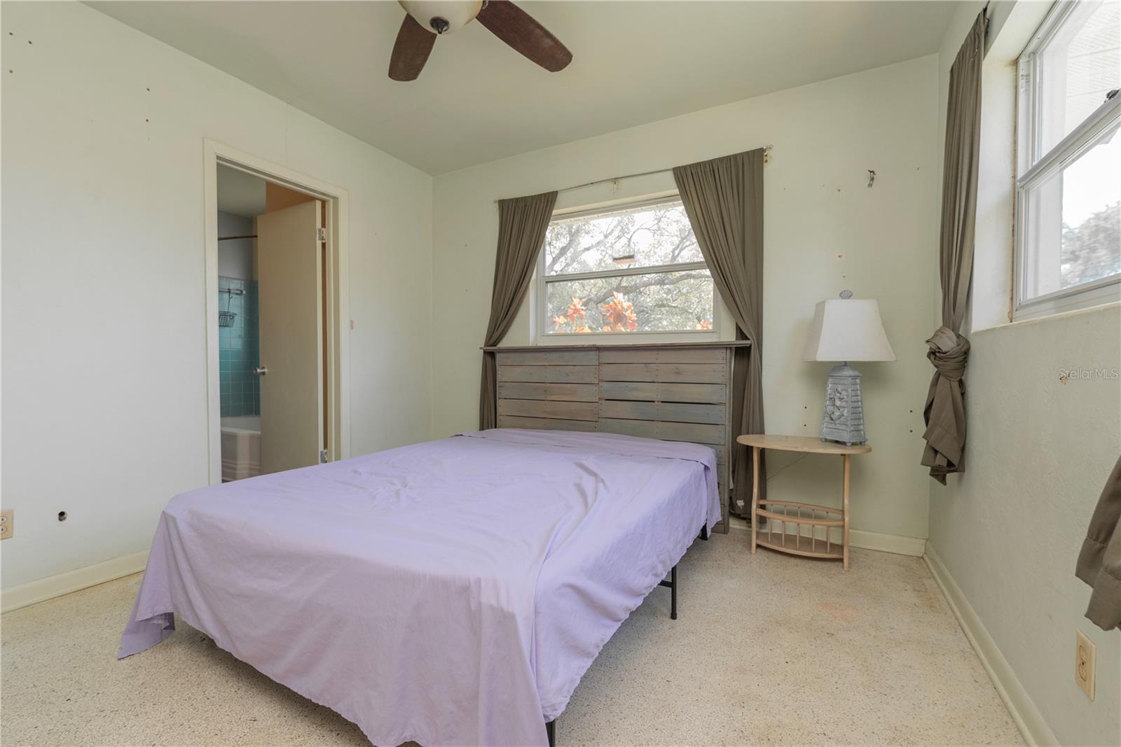 Bedroom 2 has a door that leads to the guest bathroom.