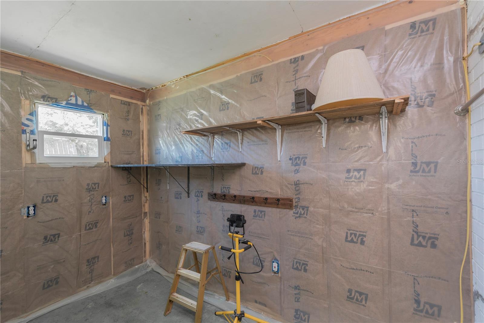Unfinished walk-in closet in bedroom 2.
