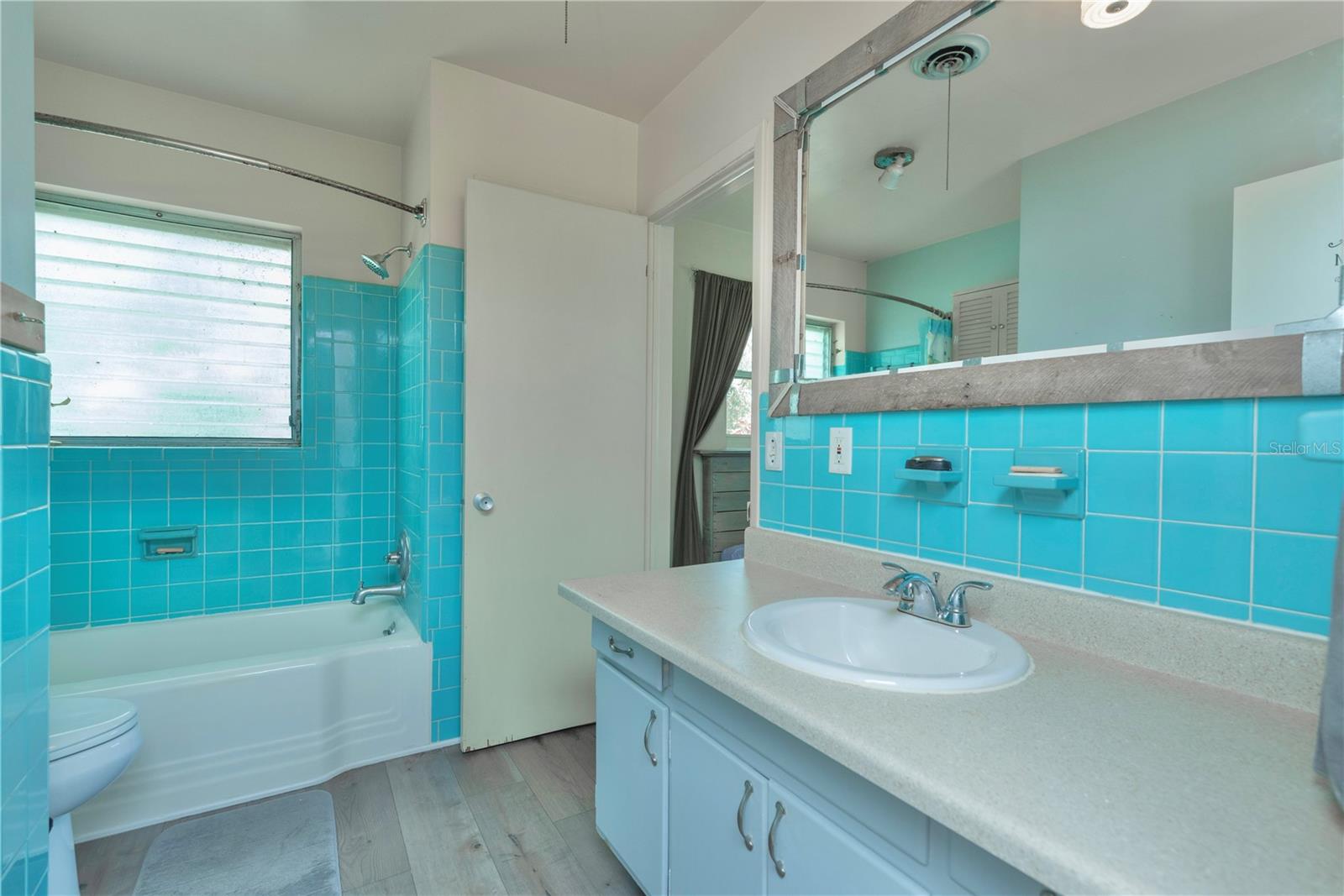 Guest bathroom with tub/shower combo.