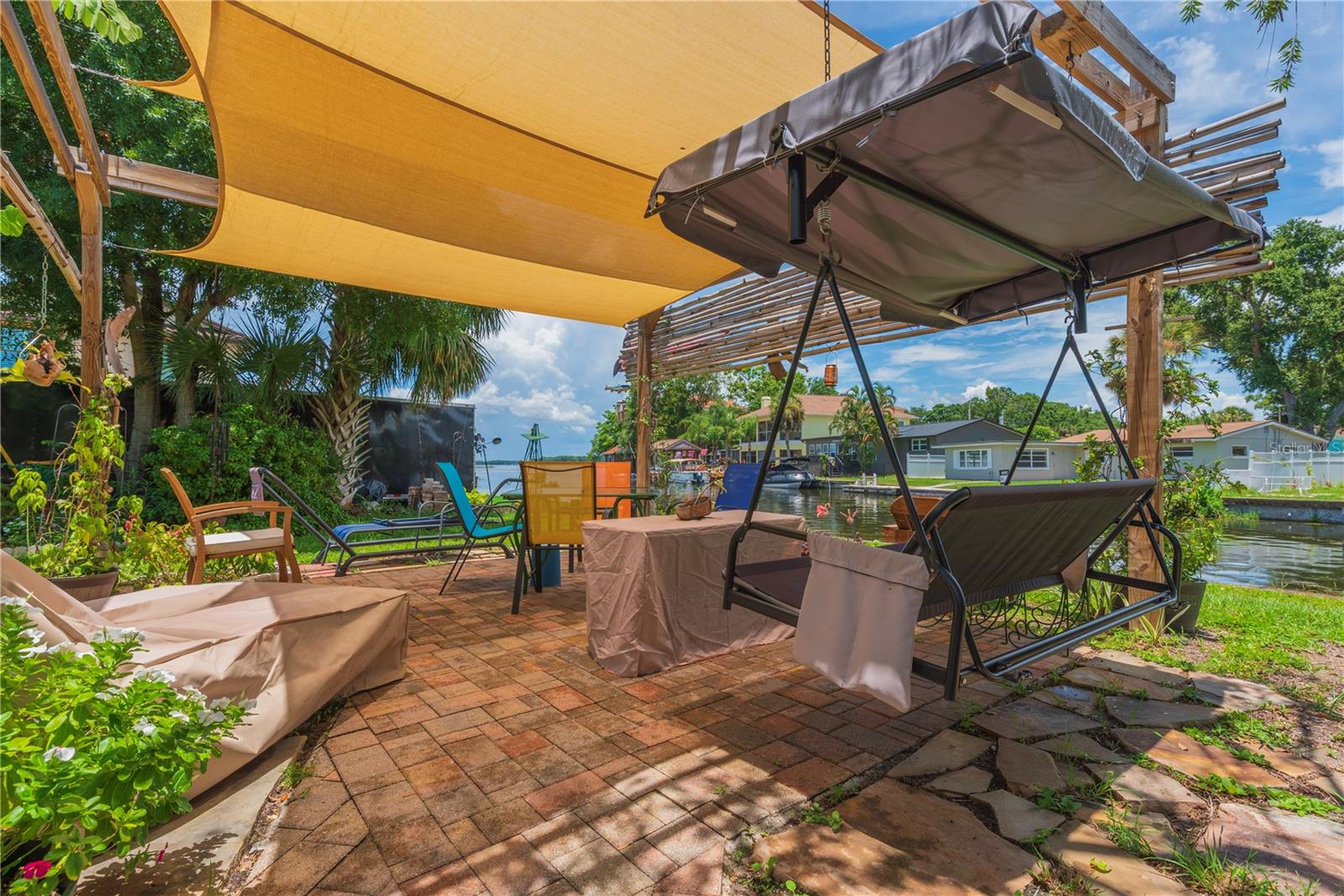 Covered patio on left side of property.