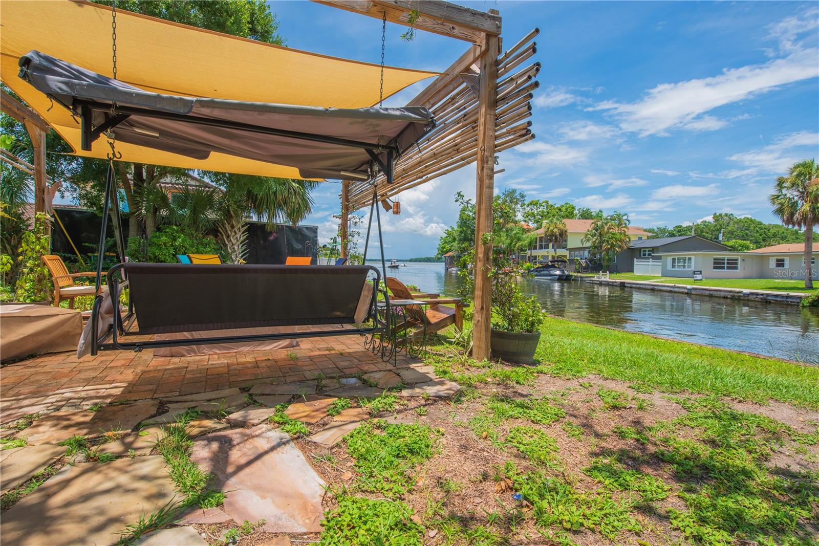 Covered patio with view to the canal.