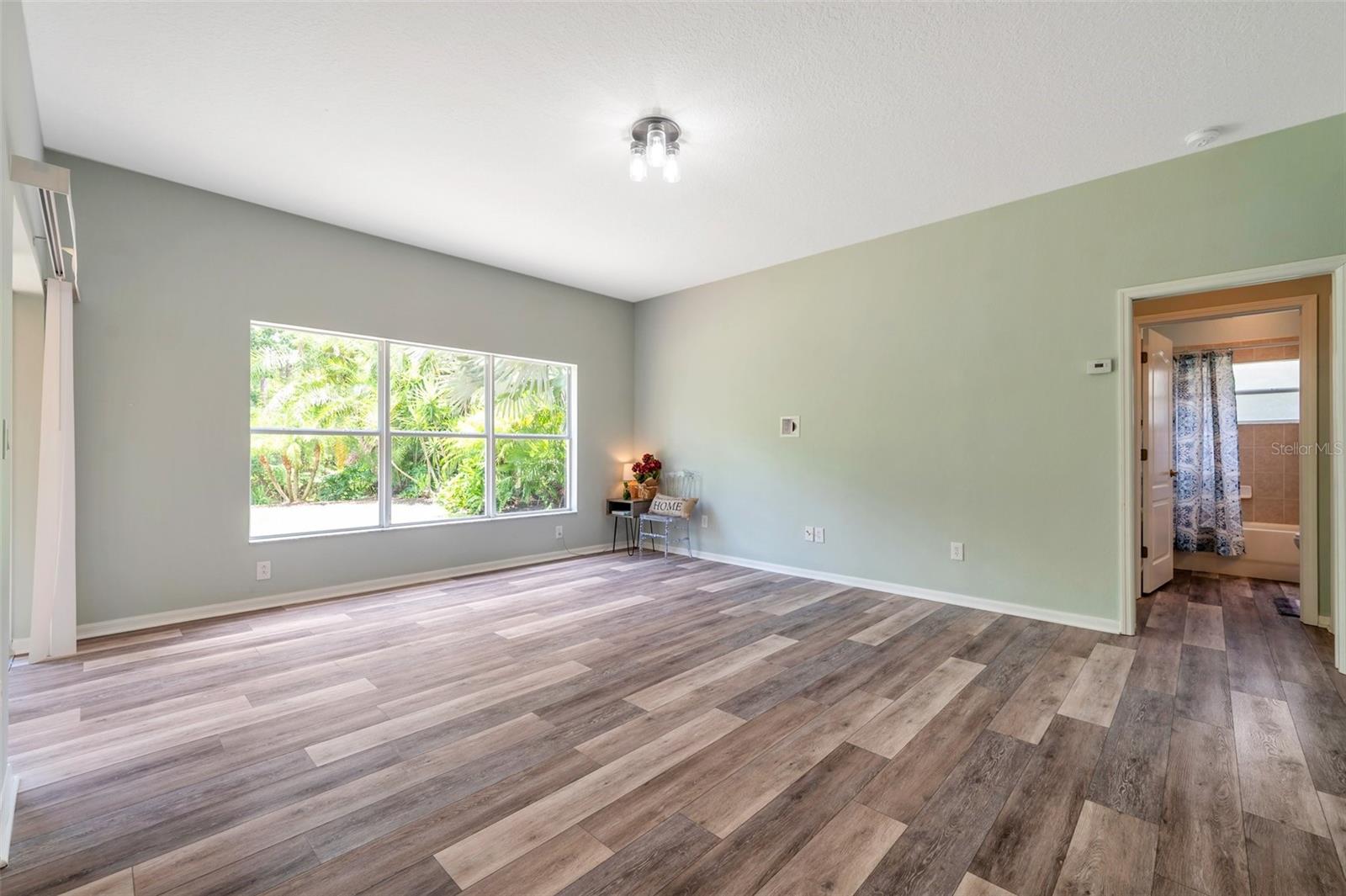 Family room with entrance into the full bath & 1st floor bed.