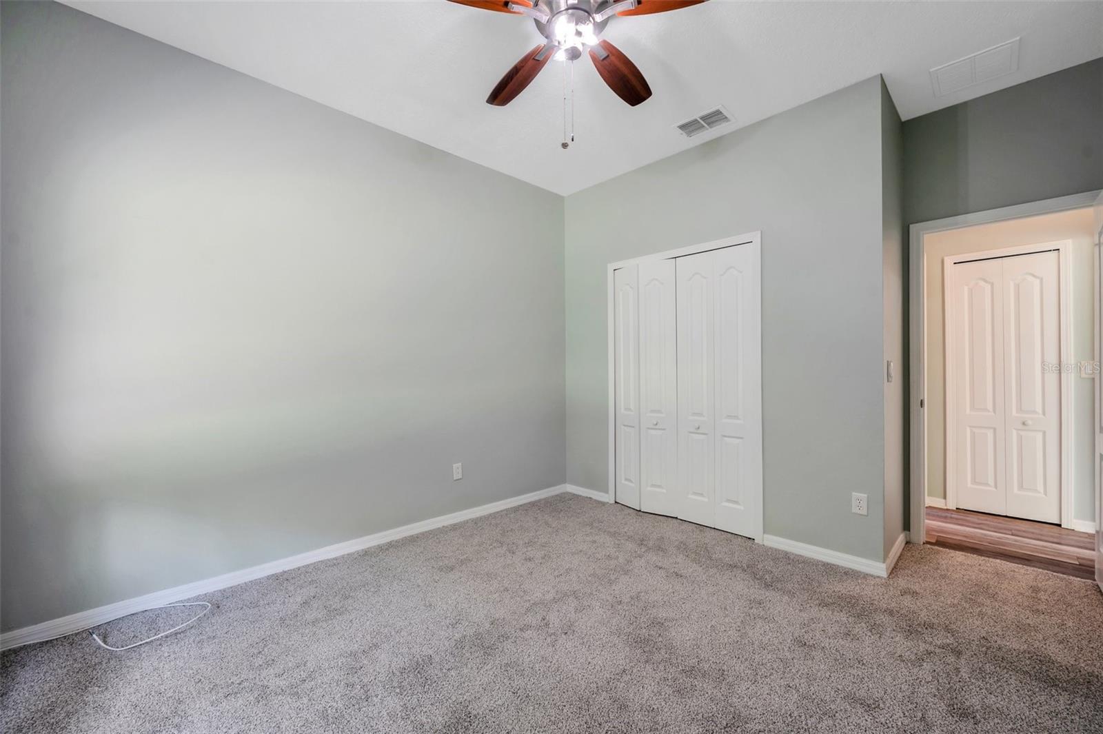 Bedroom has brand new carpet.