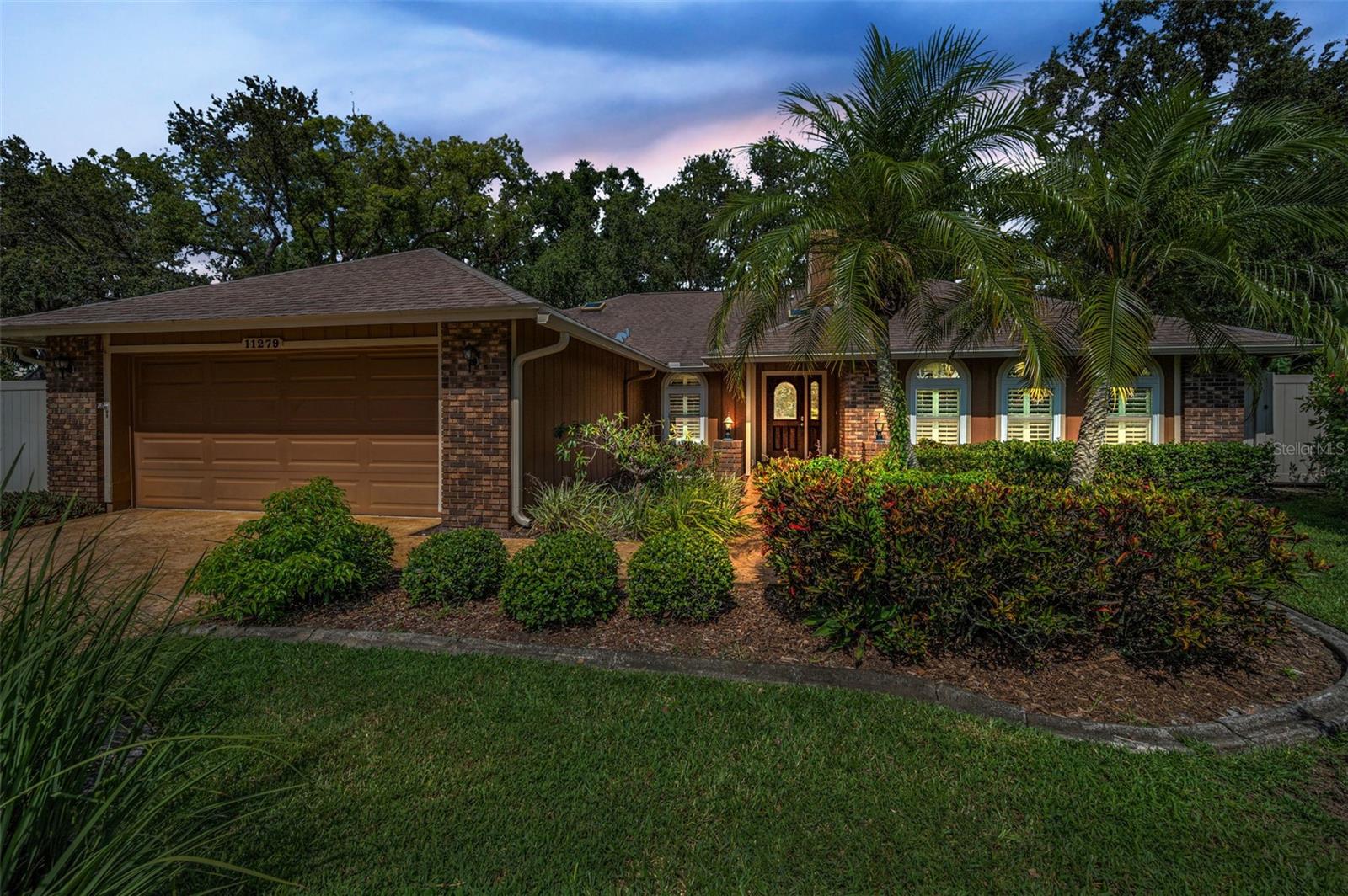 Charming curb appeal with lush landscaping