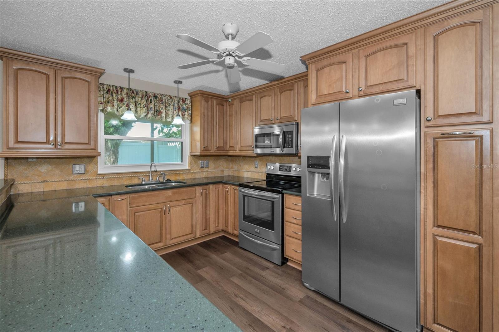 Kitchen complete with Granite countertops and stainless steel appliances