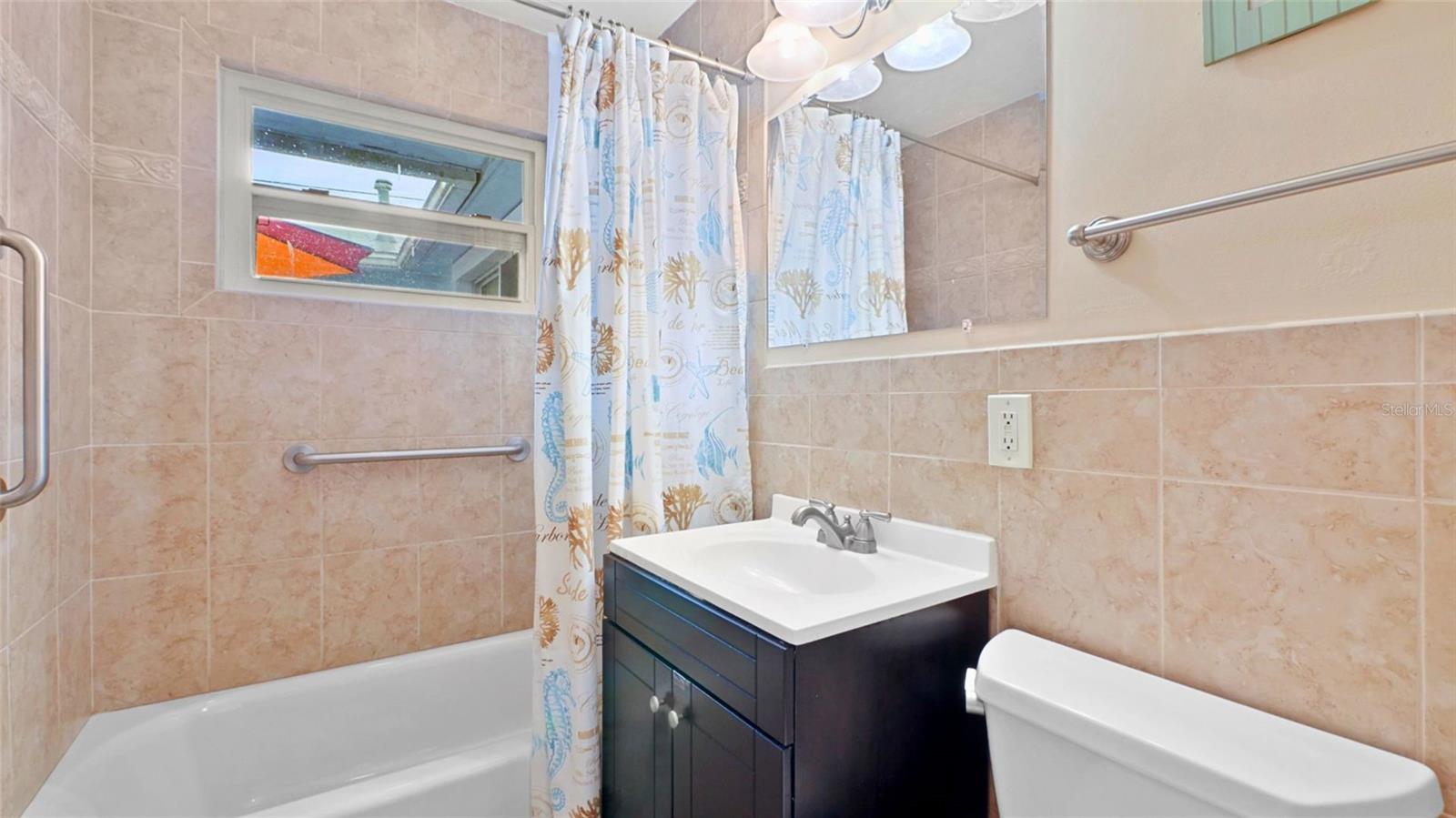 Bathroom off hallway with 2 bedrooms