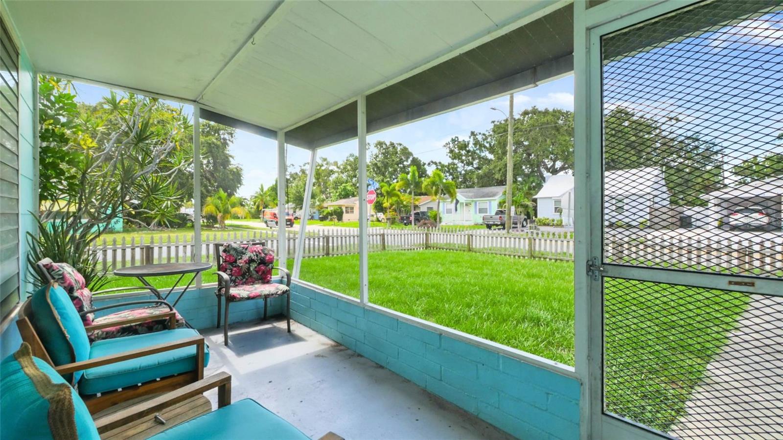 Greeted by an adorable front screened porch