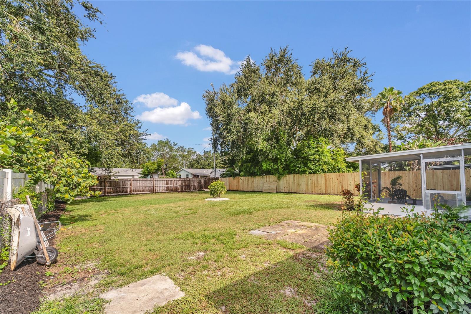 Spacious landscaped, fenced in yard full of possibilities!